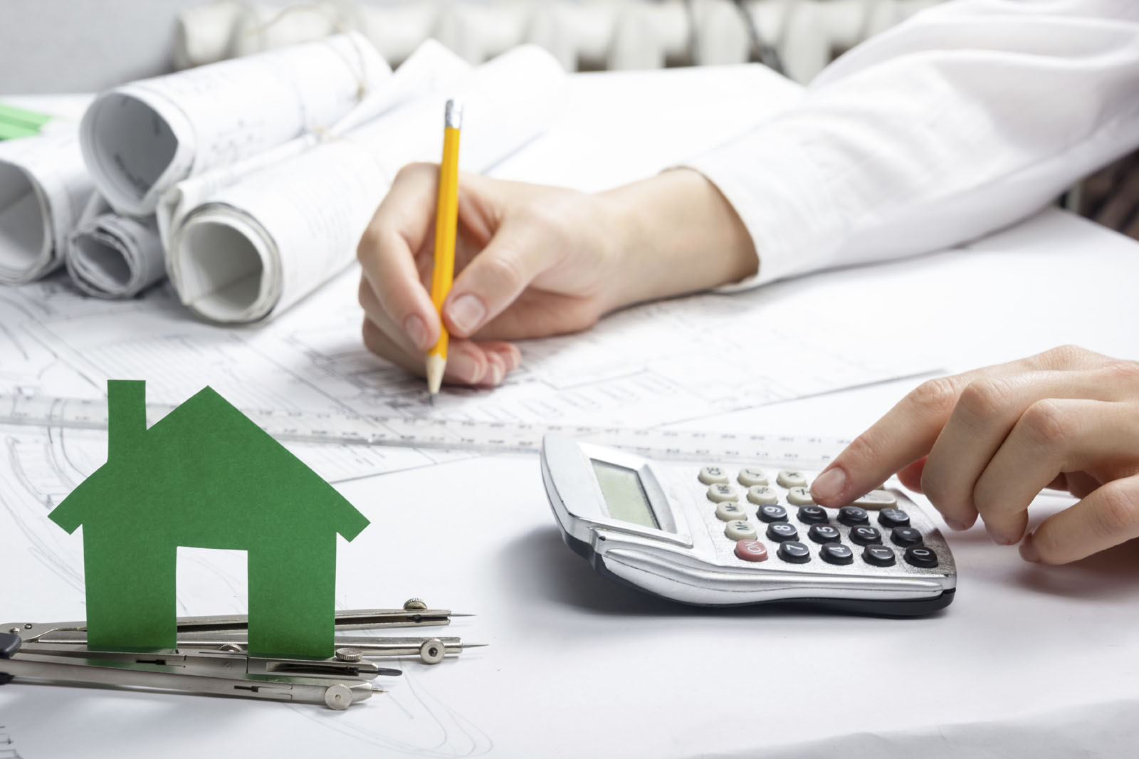 Paper house figure and blank business card on wooden background. Real Estate Concept. Top view.