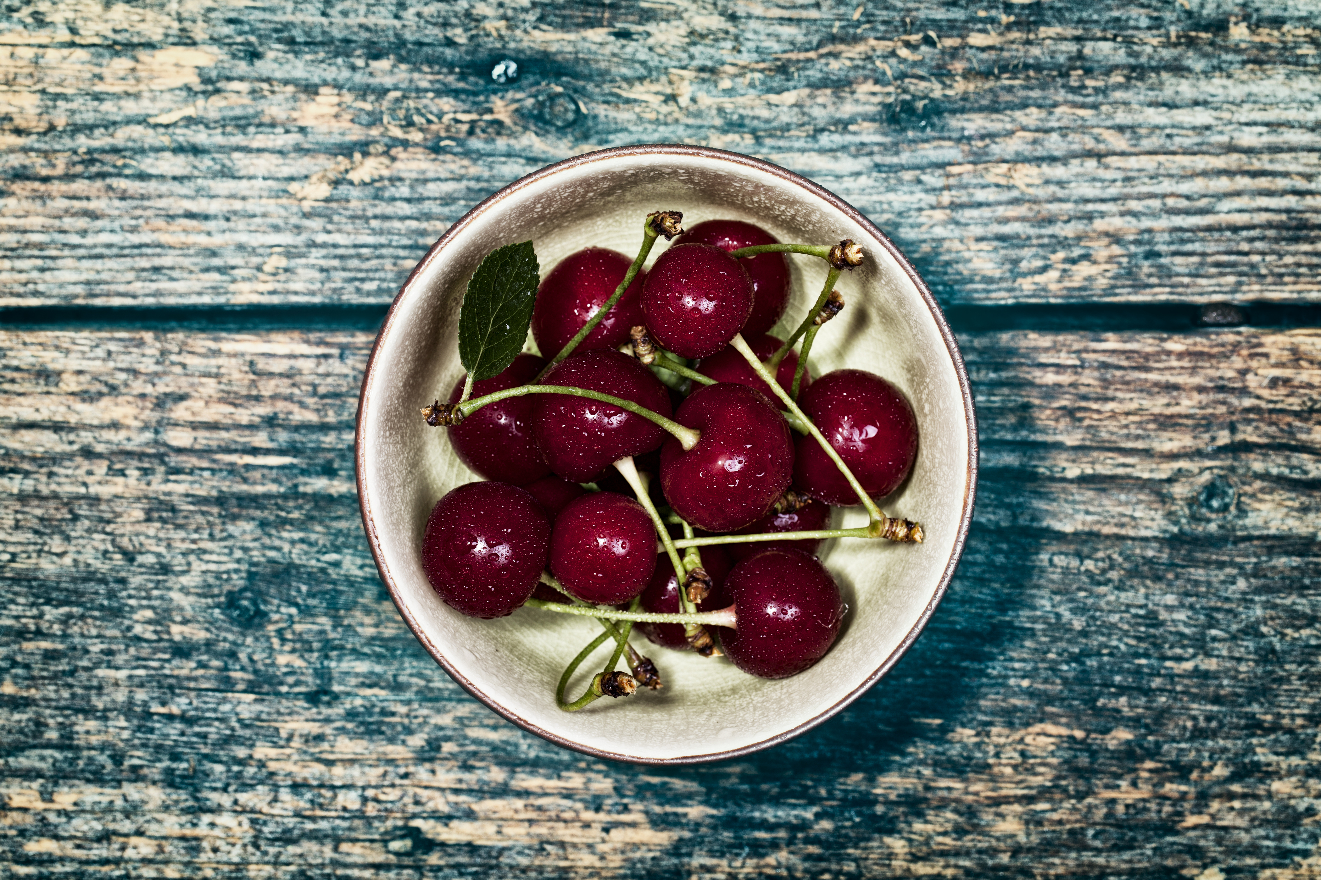 Sour Cherry in Bowl on wood Table