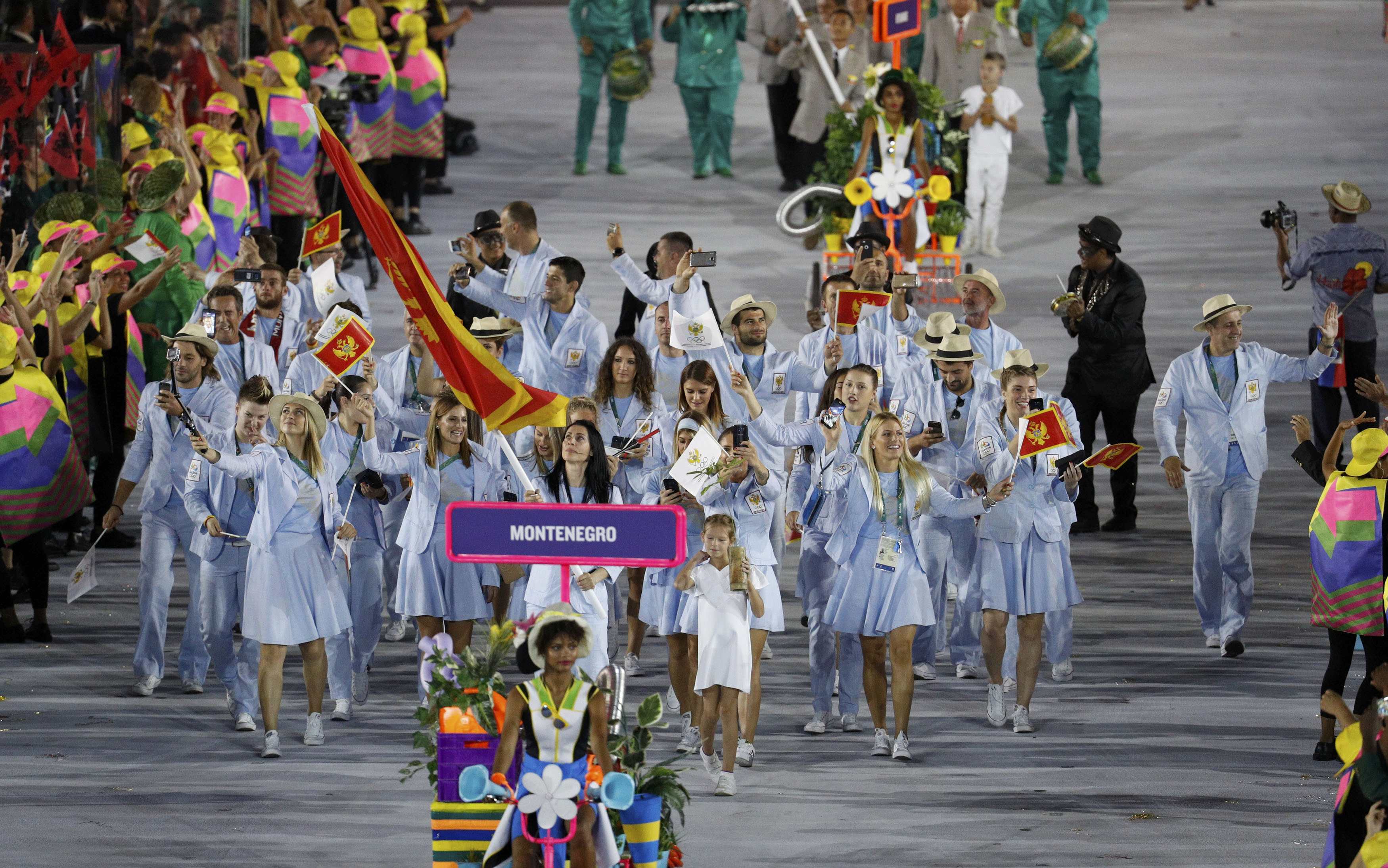 2016 Rio Olympics - Opening ceremony - Maracana - Rio de Janeiro, Brazil - 05/08/2016. Flagbearer Bojana Popovic (MNE) of Montenegro  leads her contingent during the opening ceremony.        REUTERS/Stoyan Nenov  FOR EDITORIAL USE ONLY. NOT FOR SALE FOR MARKETING OR ADVERTISING CAMPAIGNS.  