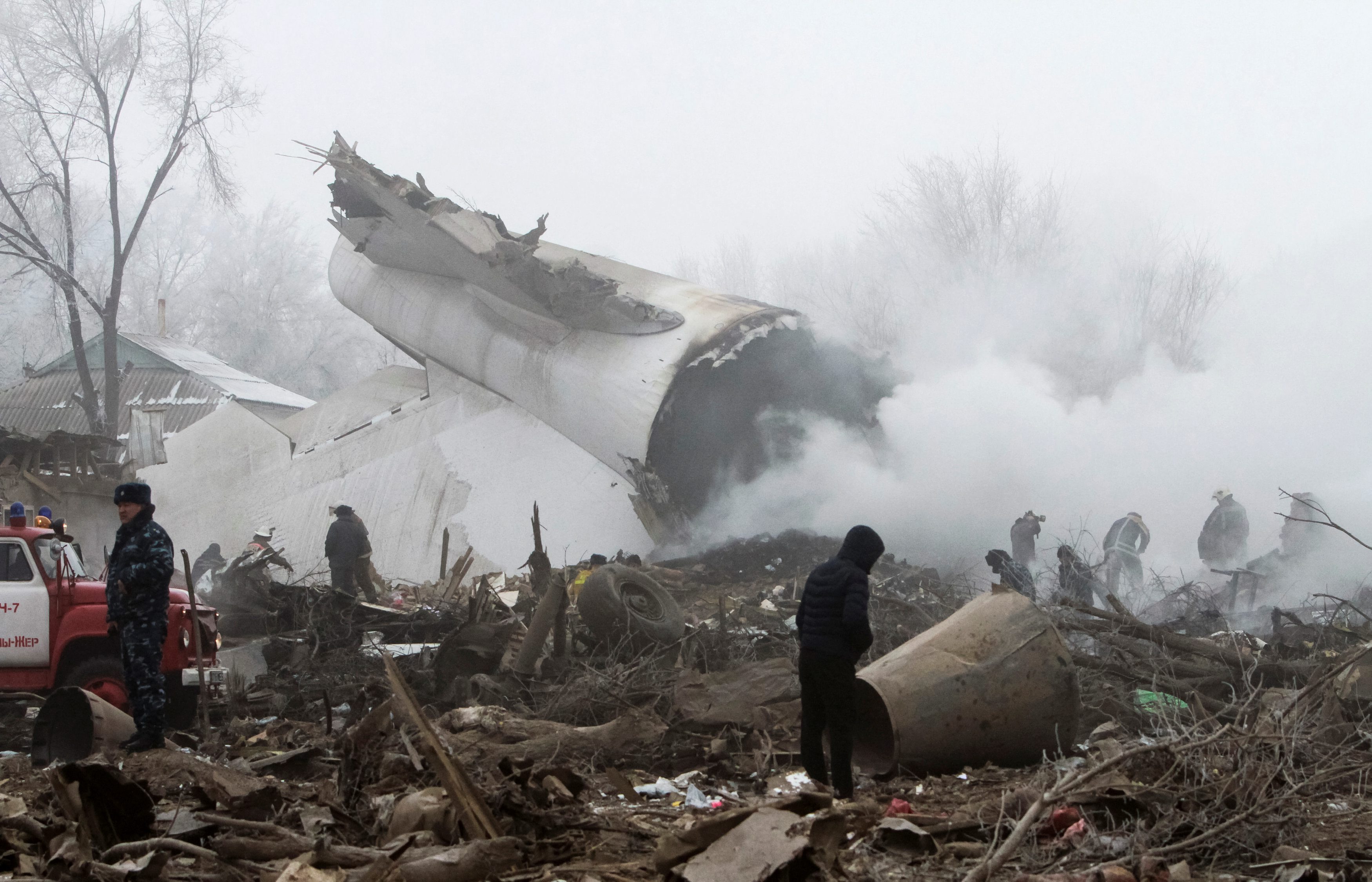 Rescue teams are seen at the crash site of a Turkish cargo jet near Kyrgyzstan's Manas airport outside Bishkek, January 16, 2017. REUTERS/Vladimir Pirogov TPX IMAGES OF THE DAY