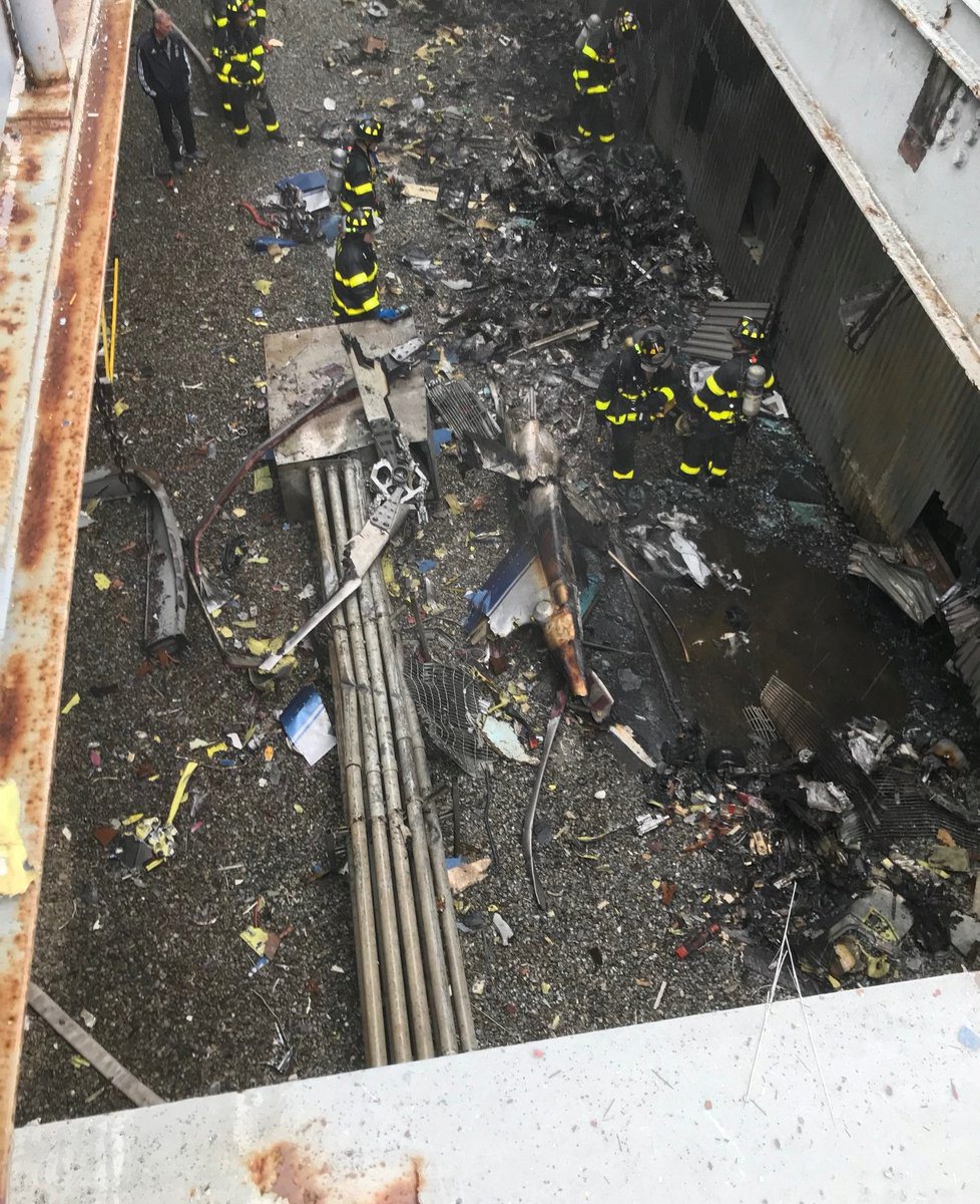 Emergency crews survey damage on a rooftop of a building after a helicopter crash in New York City, New York, U.S., June 10, 2019.    New York City Fire Department/Handout via REUTERS  ATTENTION EDITORS - THIS IMAGE HAS BEEN SUPPLIED BY A THIRD PARTY.