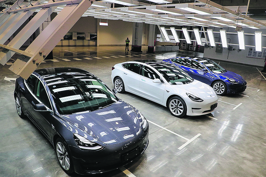 Tesla Model 3 cars are displayed during the Tesla China-made Model 3 Delivery Ceremony in Shanghai. - Tesla CEO Elon Musk presented the first batch of made-in-China cars to ordinary buyers on January 7, 2020 in a milestone for the company's new Shanghai 