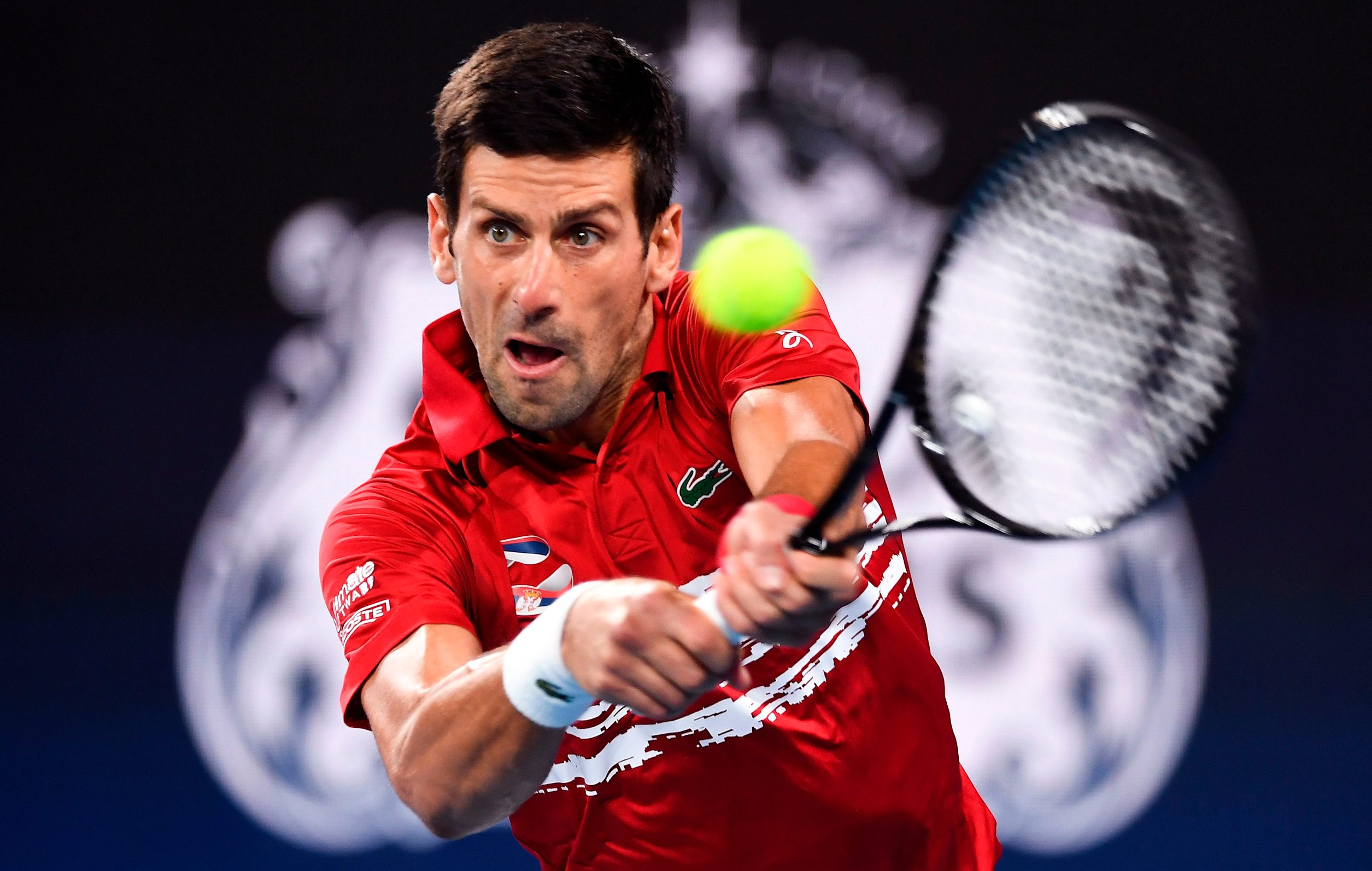 Novak Djokovic of Serbia hits a return against Rafael Nadal of Spain in their men's singles match in the final of the ATP Cup tennis tournament in Sydney on January 12, 2020. (Photo by William WEST / AFP) / -- IMAGE RESTRICTED TO EDITORIAL USE - STRICTLY NO COMMERCIAL USE --
