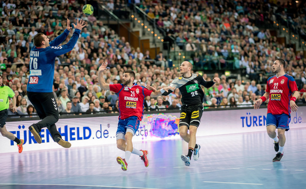 LEIPZIG, GERMANY - APRIL 04: Tim Hornke (2nd right) of Germany is challenged by Vladimir Cupara (L), Mladen Krsmancic (R) and Vanja Ilic of Serbia during the handball international friendly match between Germany and Serbia at Arena Leipzig on April 4, 2018 in Leipzig, Germany. (Photo by Thomas Eisenhuth/Bongarts/Getty Images)