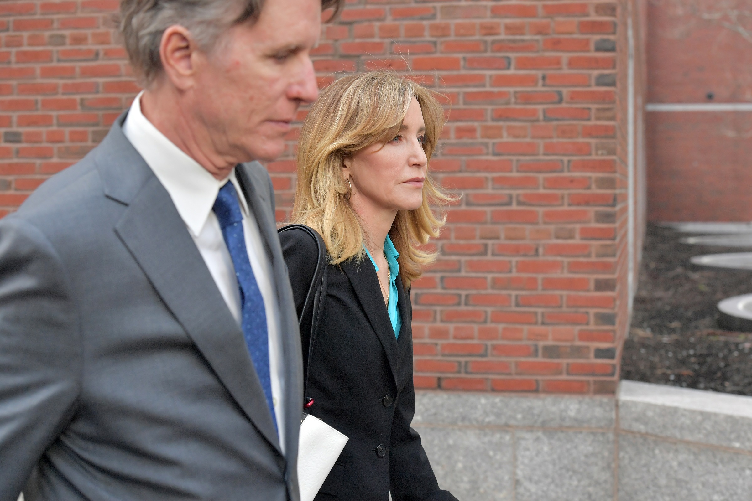 BOSTON, MA - APRIL 03:  Felicity Huffman exits the John Joseph Moakley U.S. Courthouse after appearing in Federal Court to answer charges stemming from college admissions scandal on April 3, 2019 in Boston, Massachusetts.  (Photo by Paul Marotta/Getty Images)