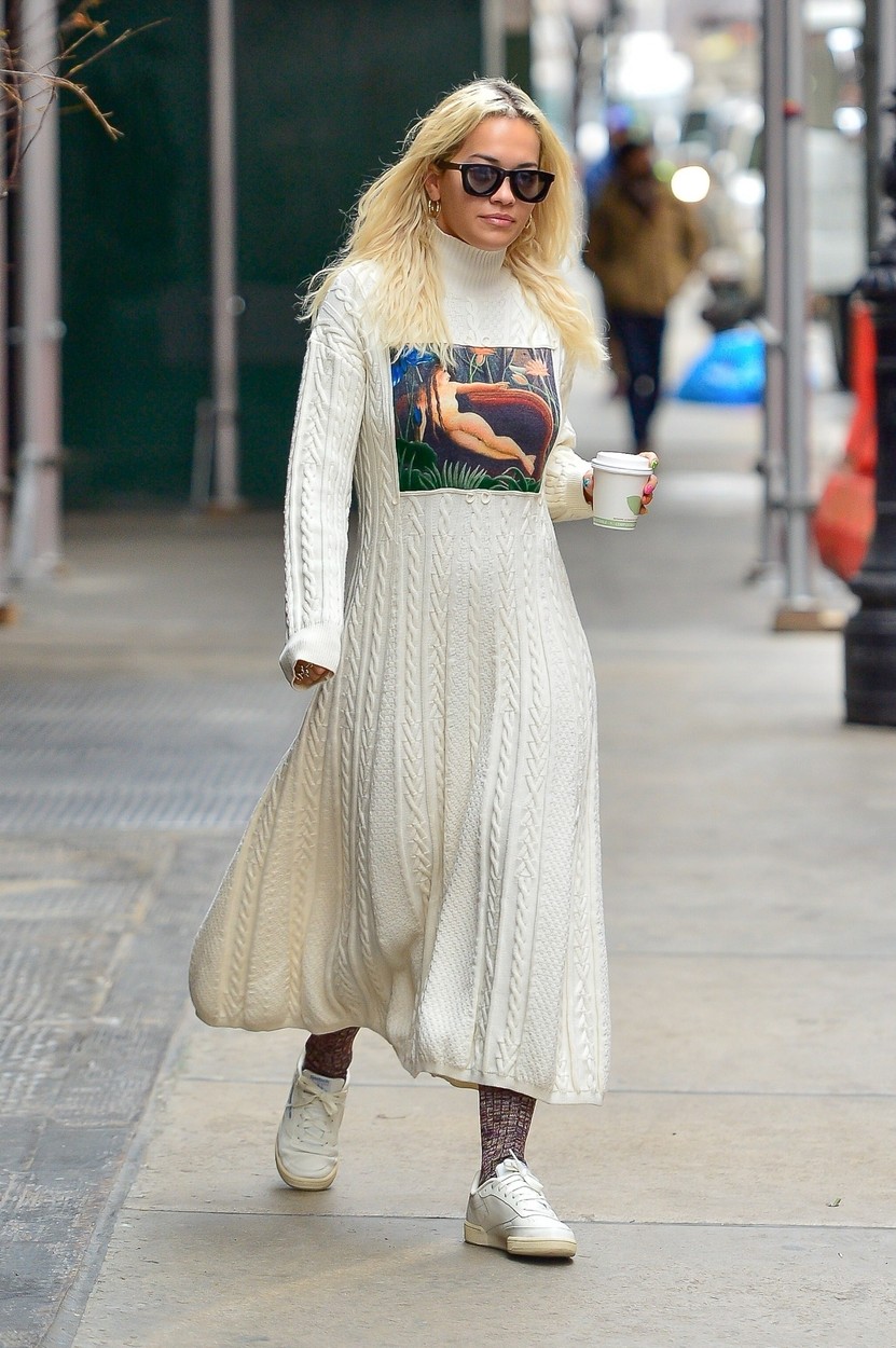 New York, NY  - British singer Rita Ora enjoys her morning coffee and shares a cute smile with our cameras while exiting a NYC Hotel donning a knit turtleneck maxi dress and white sneakers.

Pictured: Rita Ora



*UK Clients - Pictures Containing Children
Please Pixelate Face Prior To Publication*, Image: 407893996, License: Rights-managed, Restrictions: , Model Release: no, Credit line: North Woods / BACKGRID / Backgrid USA / Profimedia