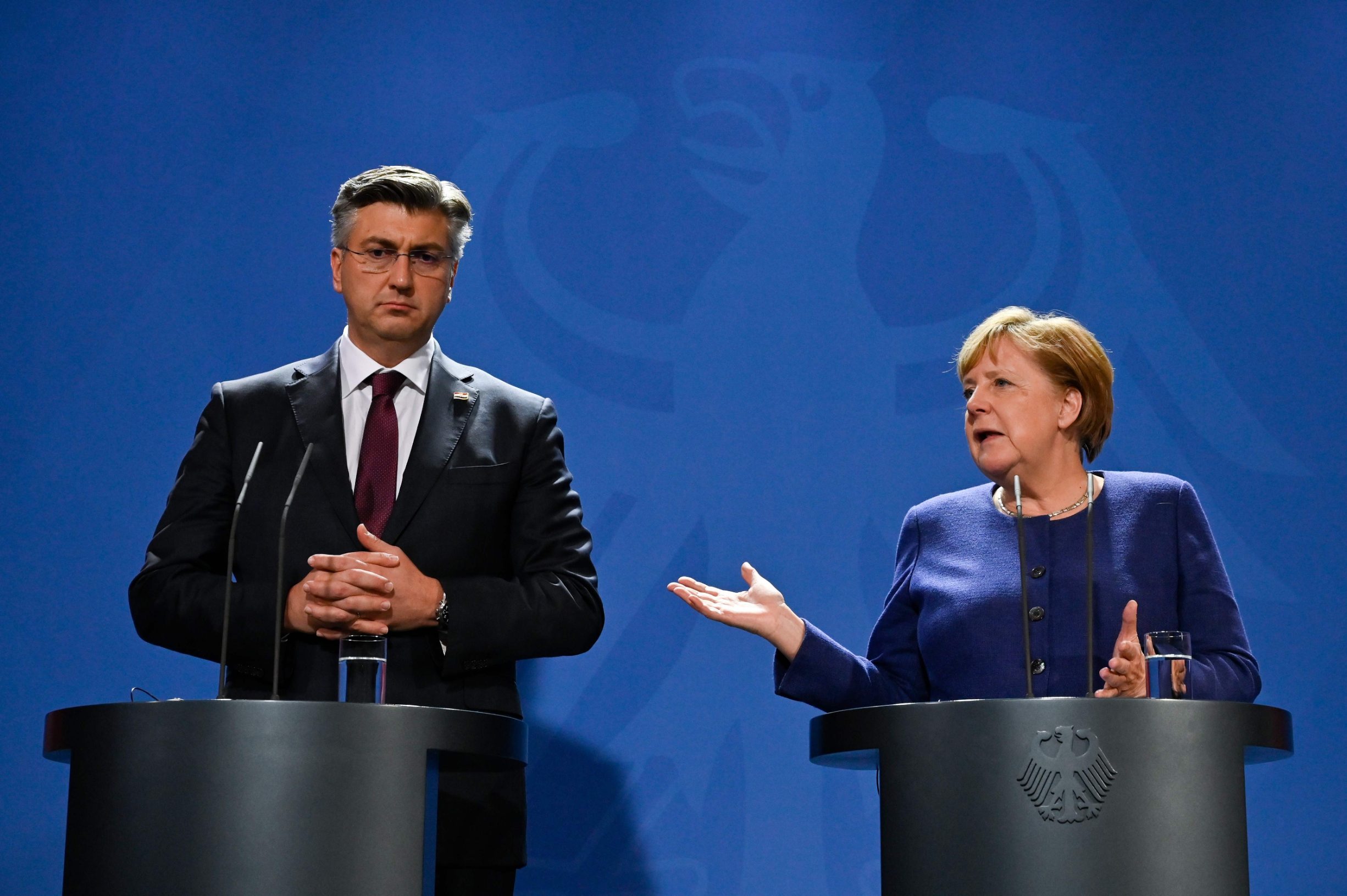 German Chancellor Angela Merkel (R) and Croatian Prime Minister Andrej Plenkovic address a press conference at the Chancellery on January 16, 2020 in Berlin. (Photo by John MACDOUGALL / AFP)
