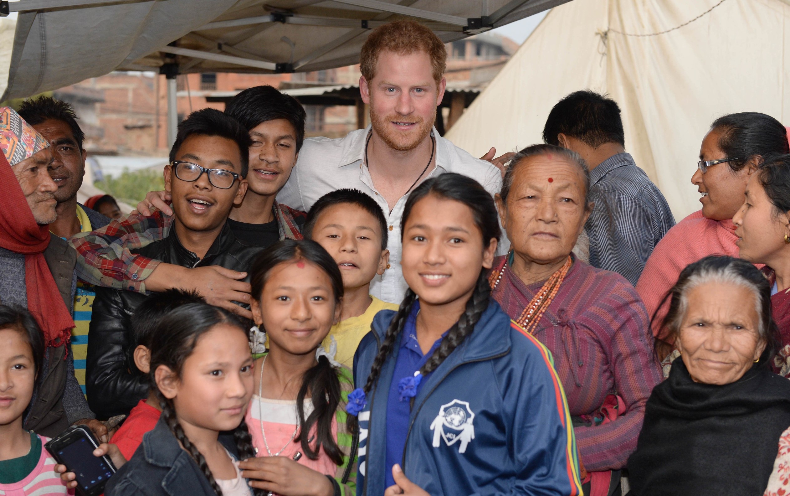 /Prince Harry pose for a selfie in the Byansi camp for families displaced in Bhaktapur, by the 2015 earthquake
Prince Harry visit to Nepal - 20 Mar 2016, Image: 278739608, License: Rights-managed, Restrictions: , Model Release: no, Credit line: REX/Shutterstock / Shutterstock Editorial / Profimedia