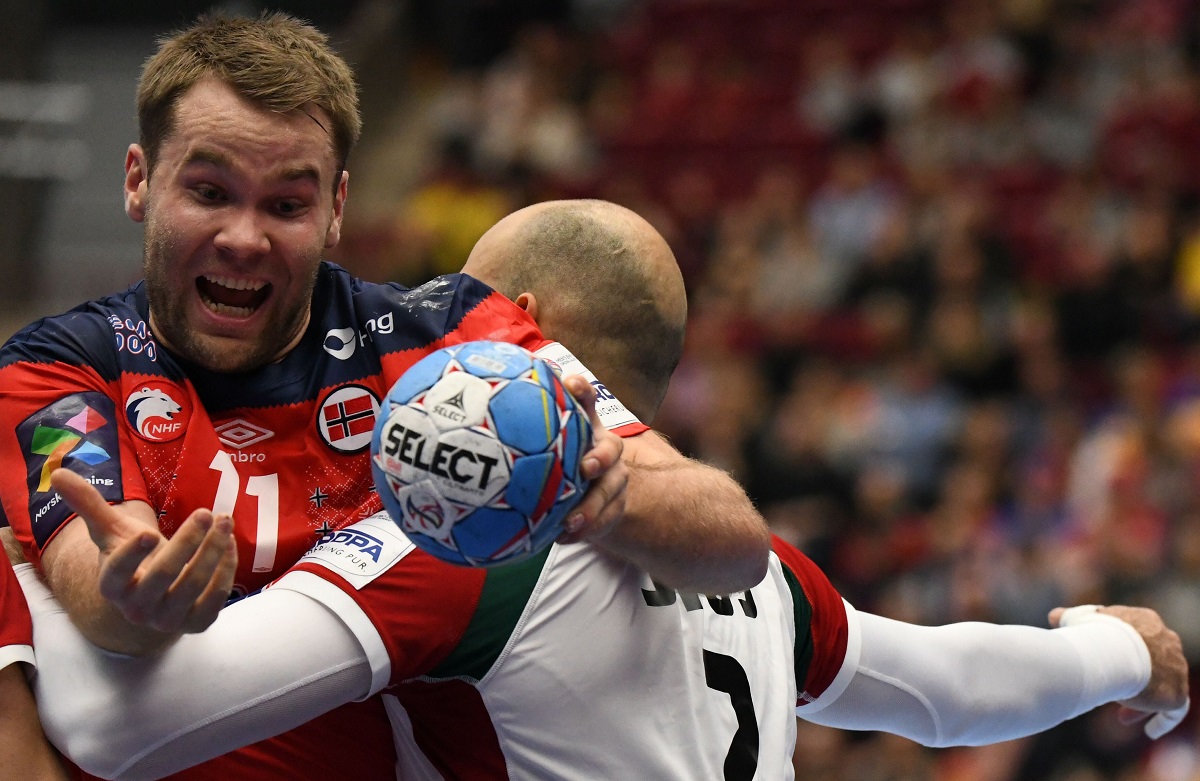 Norway's Petter Overby (L) is blocked by 02Hungary's Adrian Sipos during the Men's European Handball Championship, main round Group II match between Norway and Hungary at Malmo Arena, Sweden, on January 17, 2020. (Photo by Jonathan NACKSTRAND / AFP)