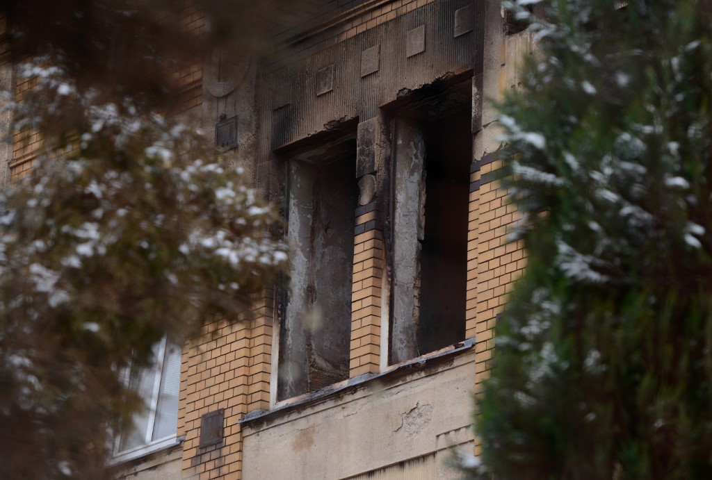 The broken windows of a home for people with learning disabilities are pictured after a fire broke out in the boys section of the building on January 19, 2020, in Vejprty village, Western Bohemia. - At least eight people died and thirty were injured after a fire at a home for people with learning disabilities in a western Czech town early Sunday, rescuers said. (Photo by Michal CIZEK / AFP)