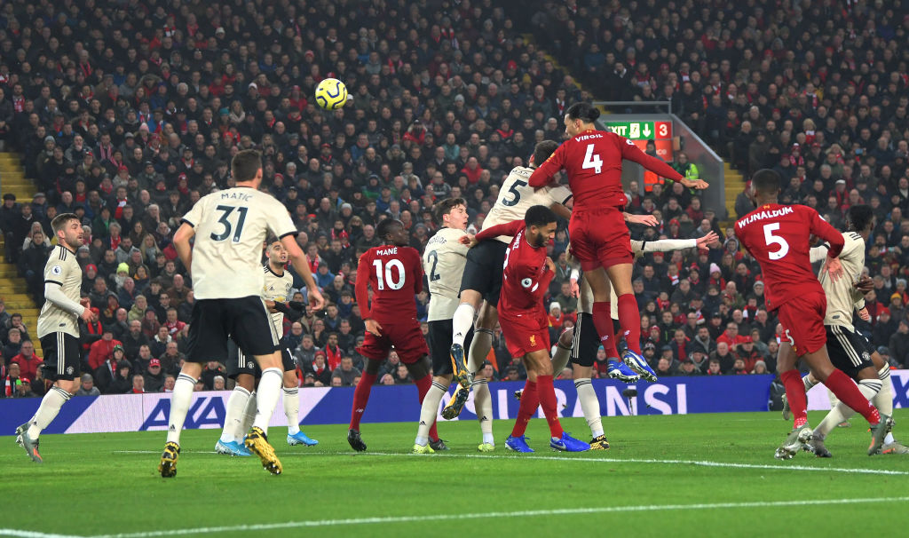 LIVERPOOL, ENGLAND - JANUARY 19: Virgil van Dijk of Liverpool scores his team's first goal during the Premier League match between Liverpool FC and Manchester United at Anfield on January 19, 2020 in Liverpool, United Kingdom. (Photo by Michael Regan/Getty Images)
