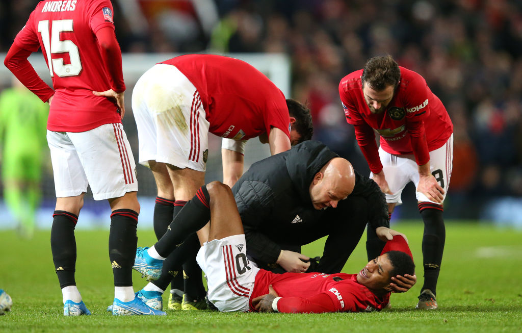MANCHESTER, ENGLAND - JANUARY 15:  Marcus Rashford of Manchester United receives treatment during the FA Cup Third Round Replay match between Manchester United and Wolverhampton Wanderers at Old Trafford on January 15, 2020 in Manchester, England. (Photo by Alex Livesey/Getty Images)