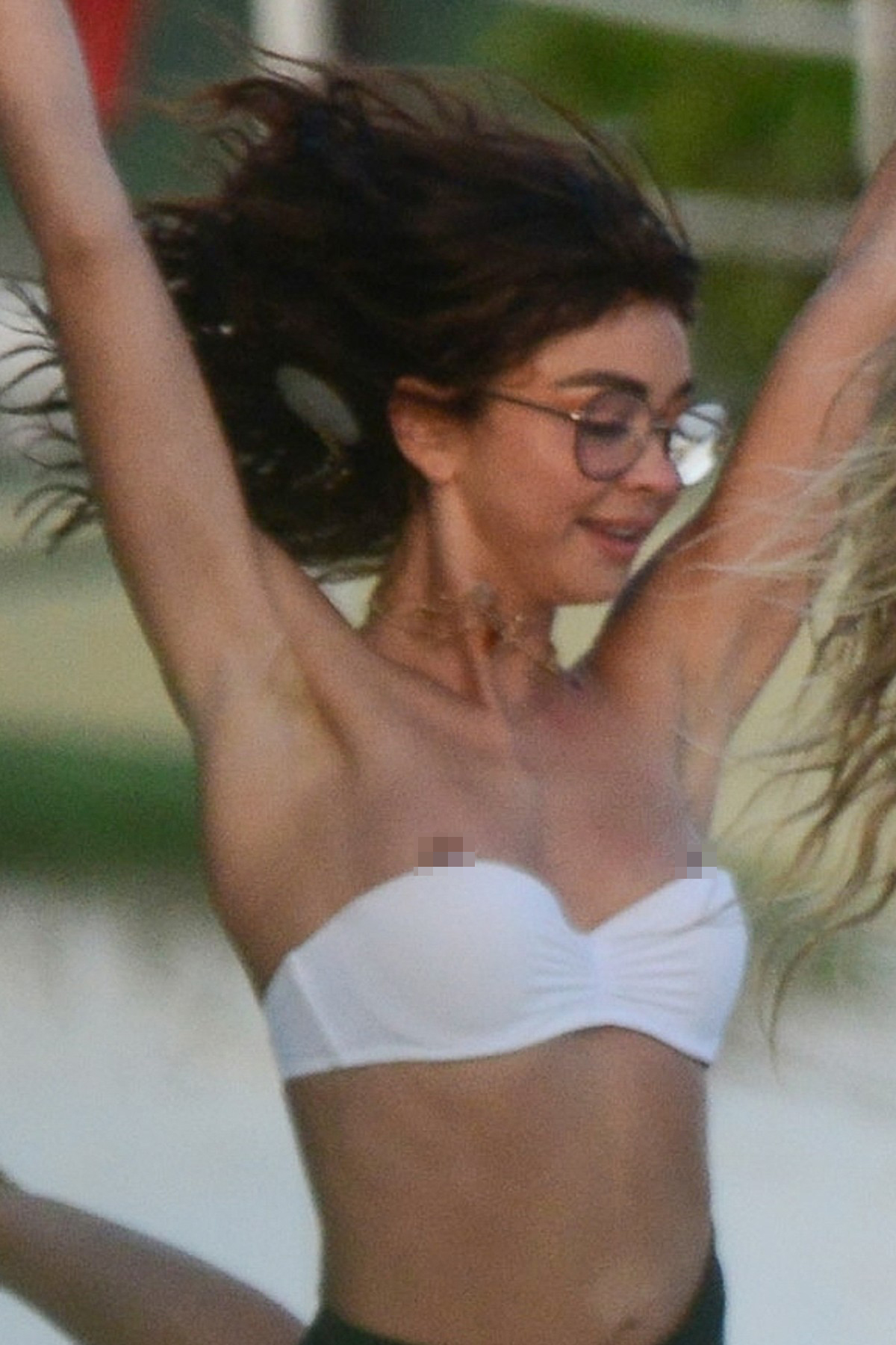 *EXCLUSIVE* Cancun, MEXICO  - Sarah Hyland suffers a wardrobe malfunction while enjoying the beach with her fiancee Wells Adams and their friends Ashley Newbrough, Ciara Robinson, and Matt Shively. Sarah is seen dancing as her tiny tube top slips too low as she suffers a nip slip. Sarah doesn't seem to mind as she continues to dance in her bikini with her friend.

*UK Clients - Pictures Containing Children
Please Pixelate Face Prior To Publication*, Image: 490466717, License: Rights-managed, Restrictions: , Model Release: no, Credit line: BACKGRID / Backgrid USA / Profimedia