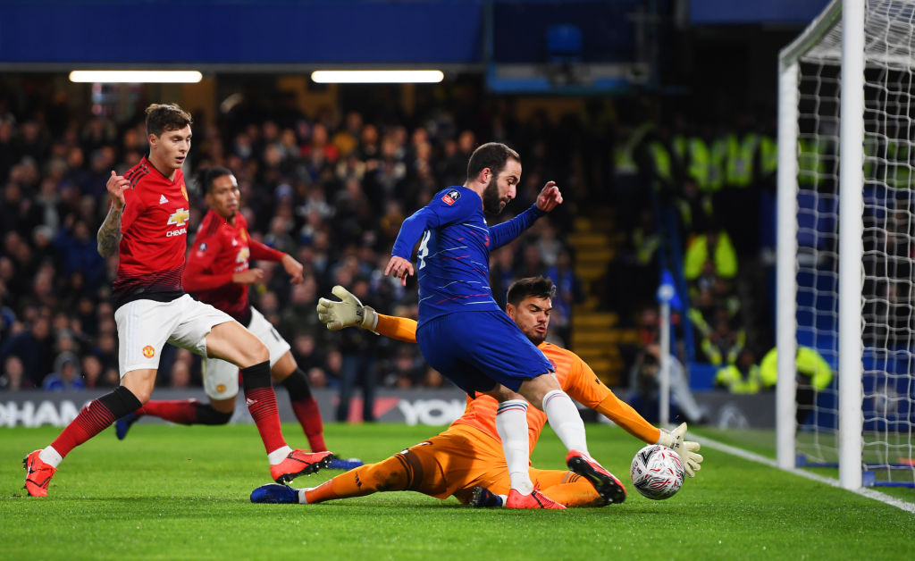 LONDON, ENGLAND - FEBRUARY 18:  Gonzalo Higuain of Chelsea is faced by Sergio Romero of Manchester United as he shoots during the FA Cup Fifth Round match between Chelsea and Manchester United at Stamford Bridge on February 18, 2019 in London, United Kingdom. (Photo by Mike Hewitt/Getty Images)