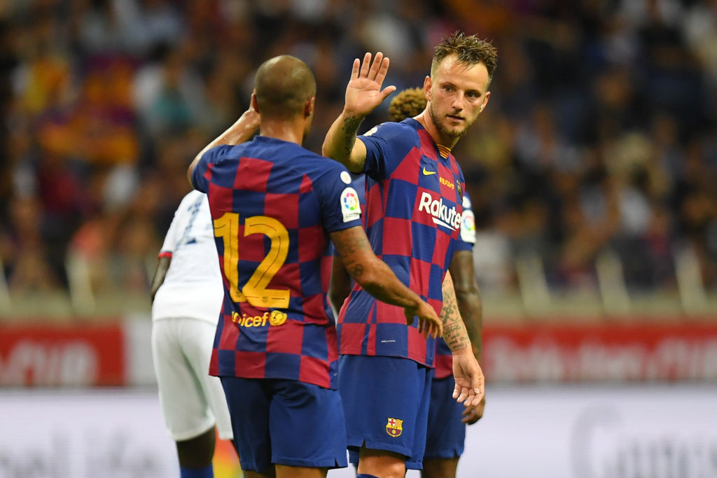 SAITAMA, JAPAN - JULY 23: Ivan Rakitic (R) of Barcelona celebrates scoring his side's first goal with his team mate Rafinha (L) during the preseason friendly match between Barcelona and Chelsea at the Saitama Stadium on July 23, 2019 in Saitama, Japan. (Photo by Atsushi Tomura/Getty Images)