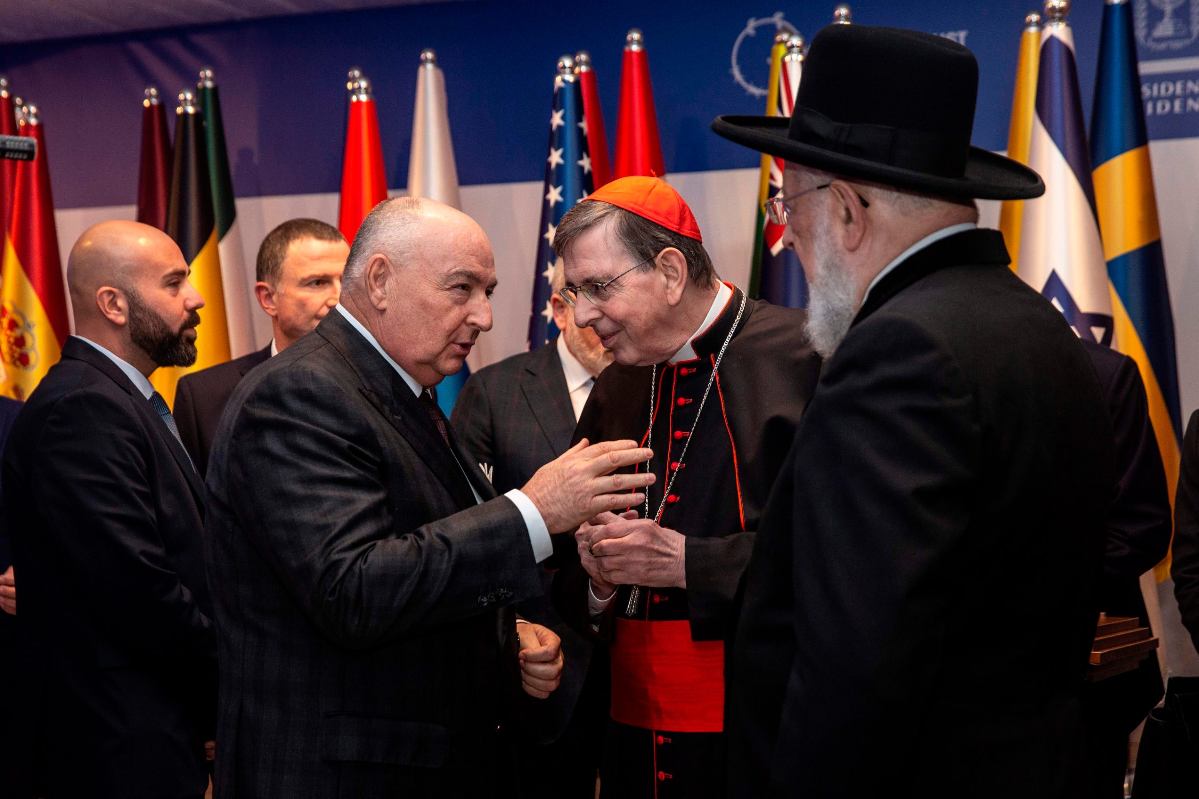Head of the European Jewish Congress Moshe Kantor (2nd L) chats with the chief rabbi of Tel Aviv Yisrael Meir Lau (R) and president of the Pontifical Council for Promoting Christian Unity Bishop Kurt Koch (2nd R) during a dinner reception at the Israeli President's official residence in Jerusalem, on January 22, 2020. - Dozens of world leaders are arriving to Israel ahead of January 23, to attend ceremonies marking 75 years since the liberation of Auschwitz, the World War II death camp where the Nazis killed more than 1.1 million people, most of them Jews. (Photo by Heidi Levine / POOL / AFP)