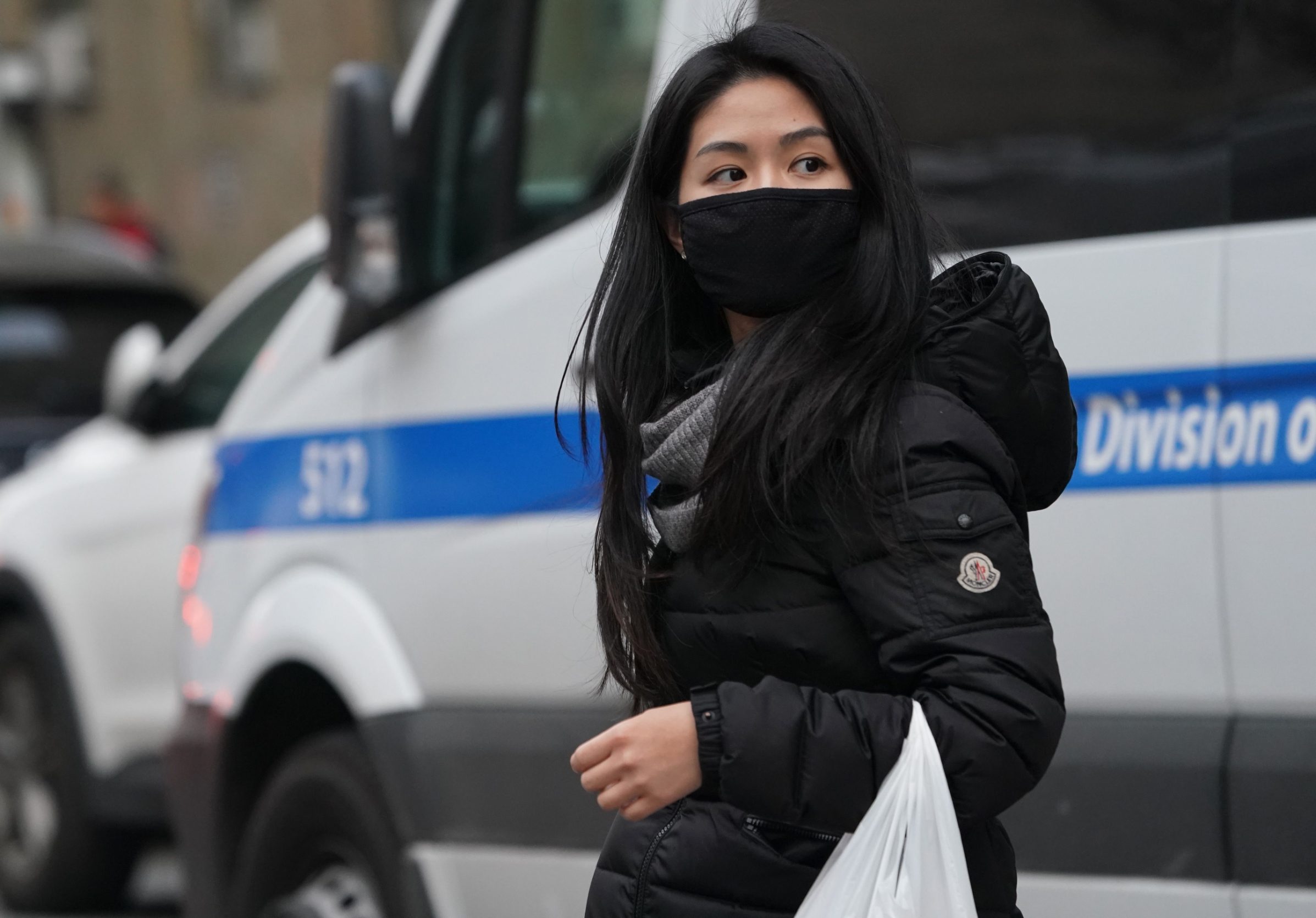 A woman wears a protective mask near the Chinatown section of New York City on January 23, 2020,as many people were seen wearing the mask in the area since the outbreak of the Wuhan Coronavirus. - Authorities in Texas are investigating a second suspected case on US soil of a deadly Chinese virus, namely a college student who had recently returned from the city at the heart of the outbreak, officials said Thursday. Brazos County, just northwest of Houston, 