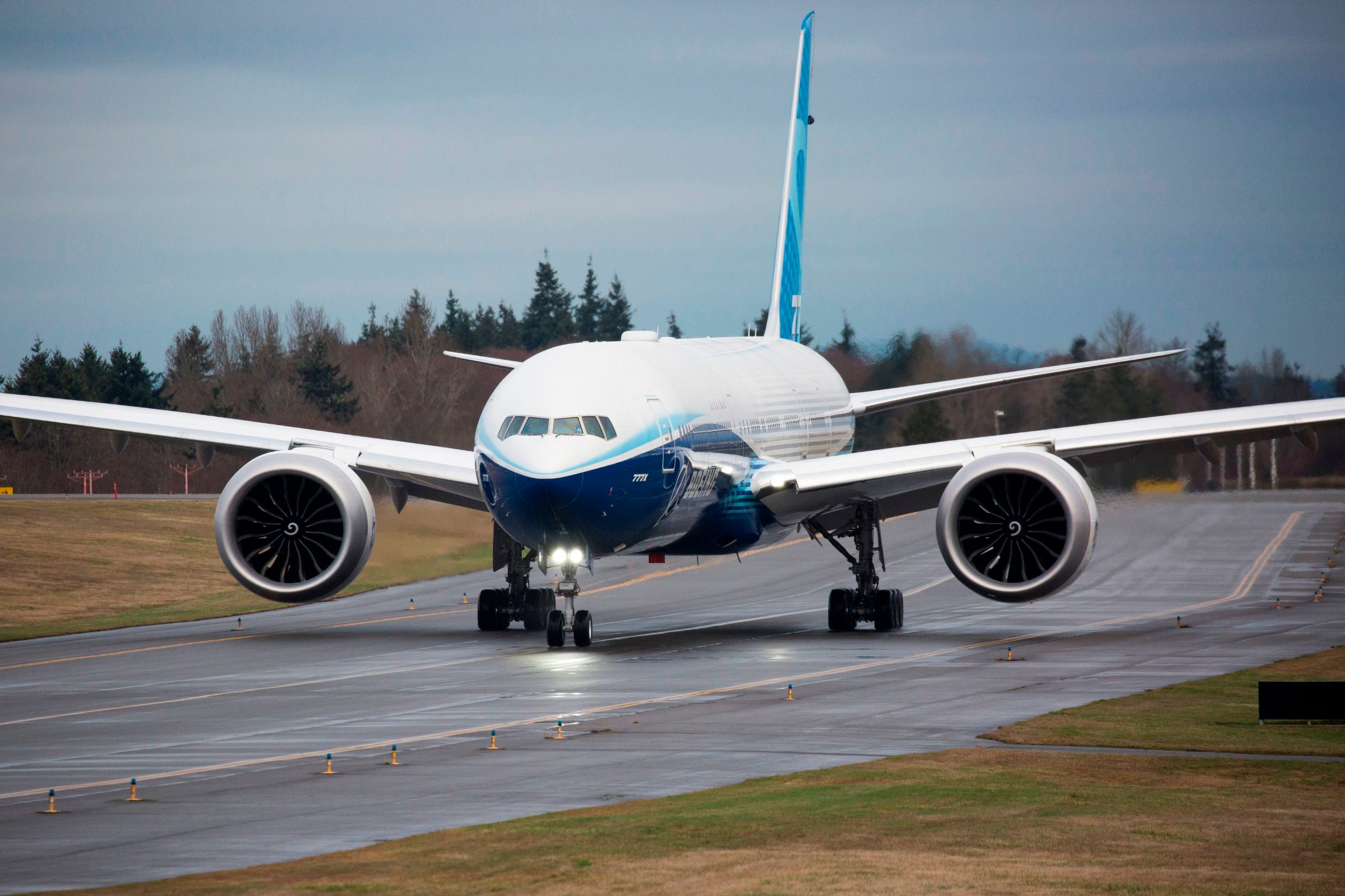 A Boeing 777X airplane taxis before taking off on its inaugural flight at Paine Field in Everett, Washington on January 25, 2020. - Boeing's new long-haul 777X airliner made its first flight Saturday, a major step forward for the company whose broader prospects remain clouded by the 737 MAX crisis. The plane took off from a rain-slicked runway a few minutes after 10:00 am local time (1800 GMT), at Paine Field in Everett, Washington, home to Boeing's manufacturing site in the northwestern US. (Photo by Jason Redmond / AFP)