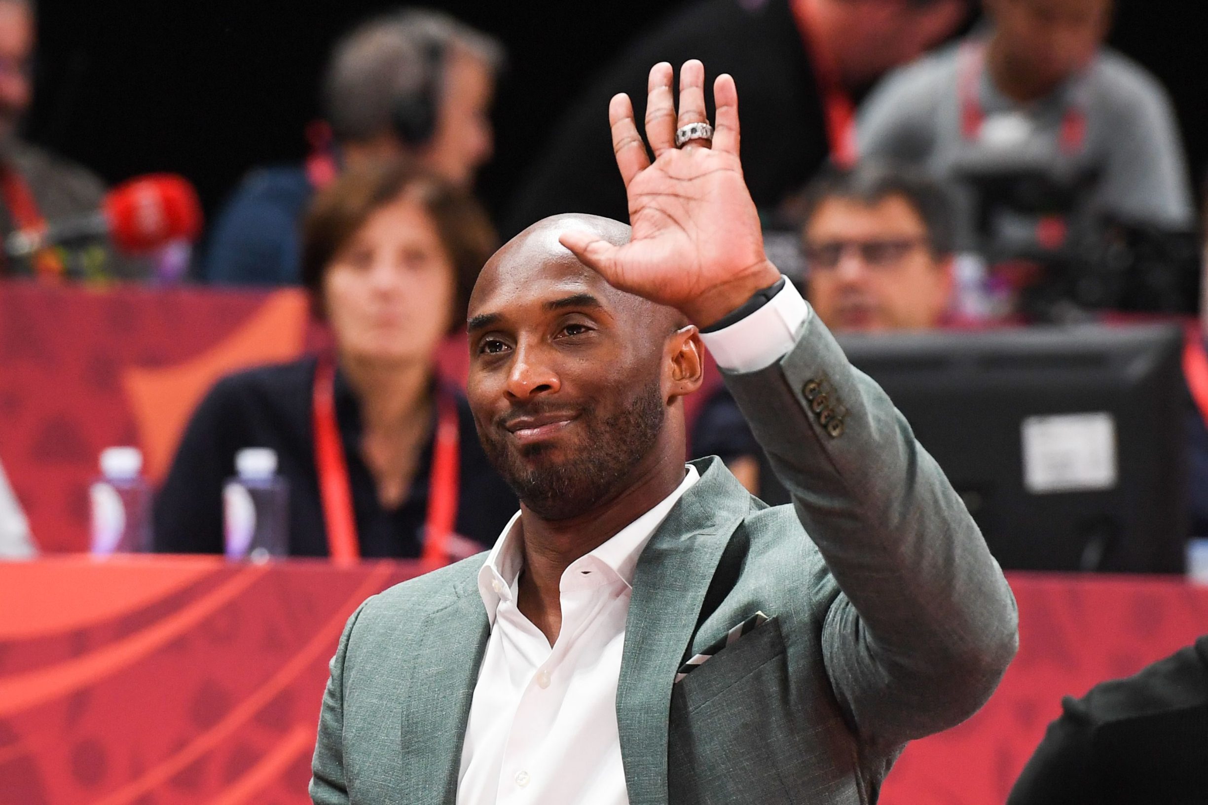 (FILES) In this file photo taken on September 13, 2019 former basketball player Kobe Bryant of the US waves at the crowd during the Basketball World Cup semi-final game between Australia and Spain in Beijing. - According to multiple US media sources,  Kobe Bryant died in a helicopter crash in Calabasas, California on January 26, 2020. (Photo by Greg BAKER / AFP)