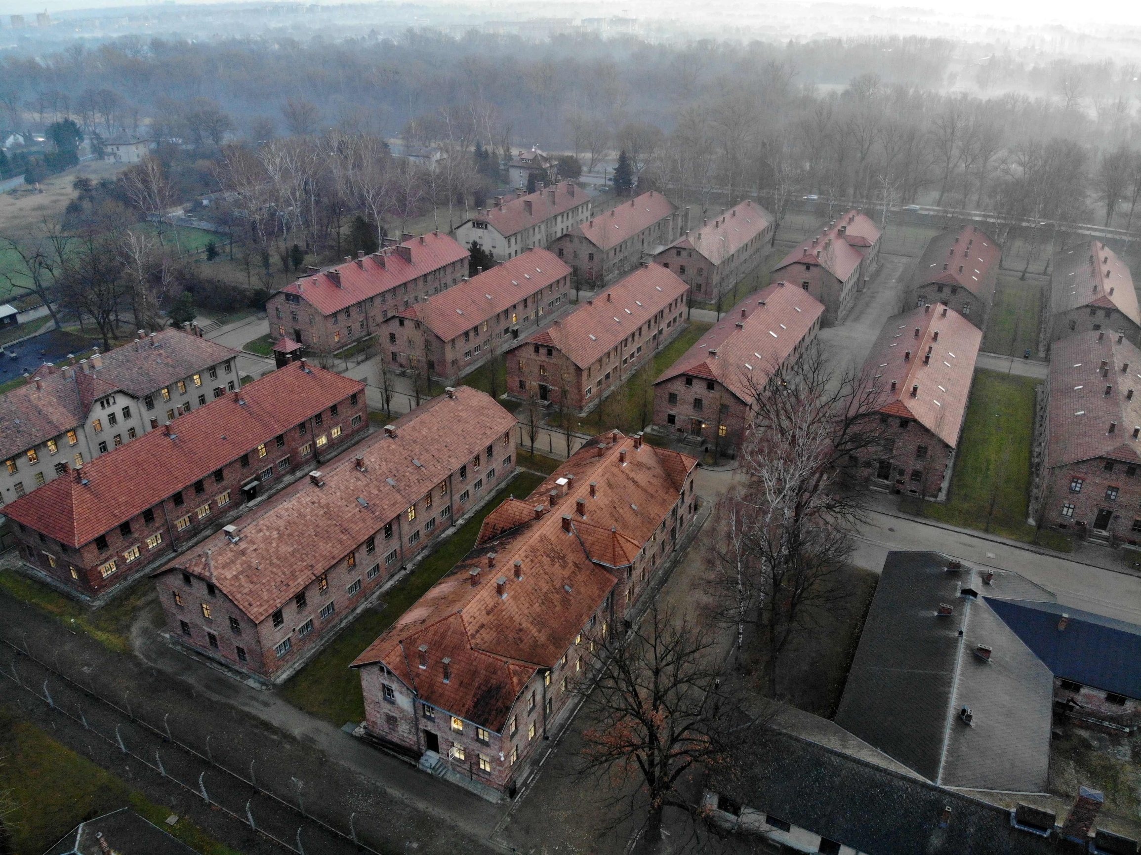 (FILES) An aerial picture taken on December 15, 2019 in Oswiecim, Poland, shows a view of the blocks of Auschwitz I, which was part of former German Nazi death camp Auschwitz-Birkenau. The site has been turned into a museum and memorial site. - Some two hundred former prisoners of the Nazi-run Auschwitz-Birkenau extermination camp, a symbol of the Holocaust of the Jews, will visit the site on January 27, 2020 to commemorate the 75th anniversary of its liberation. (Photo by Pablo GONZALEZ / AFP)