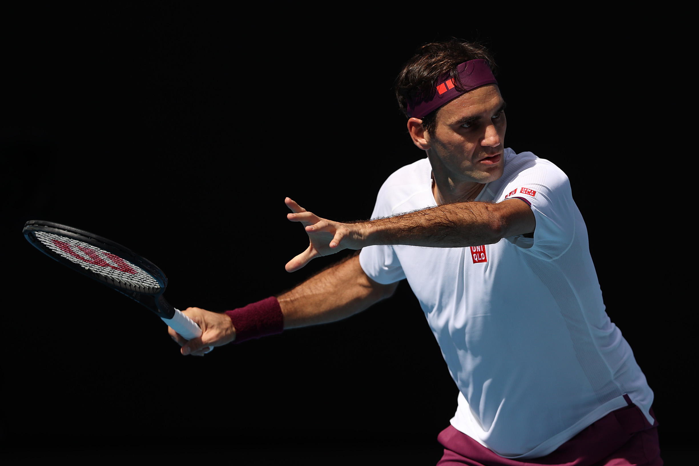 MELBOURNE, AUSTRALIA - JANUARY 28: Roger Federer of Switzerland plays a forehand during his Men’s Singles Quarterfinal match against Tennys Sandgren of the United States on day nine of the 2020 Australian Open at Melbourne Park on January 28, 2020 in Melbourne, Australia. (Photo by Clive Brunskill/Getty Images)