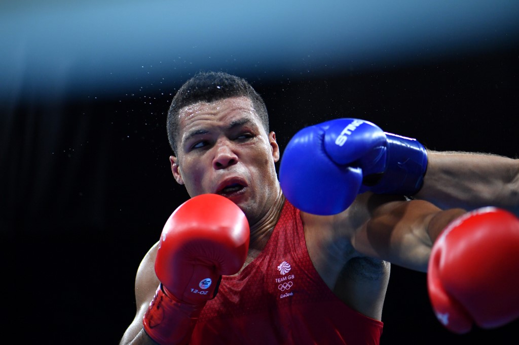 Great Britain's Joe Joyce (red) fights Kazakhstan's Ivan Dychko during the Men's Super Heavy (+91kg) Semifinal 2 at the Rio 2016 Olympic Games at the Riocentro - Pavilion 6 in Rio de Janeiro on August 19, 2016. (Photo by Yuri CORTEZ / AFP)