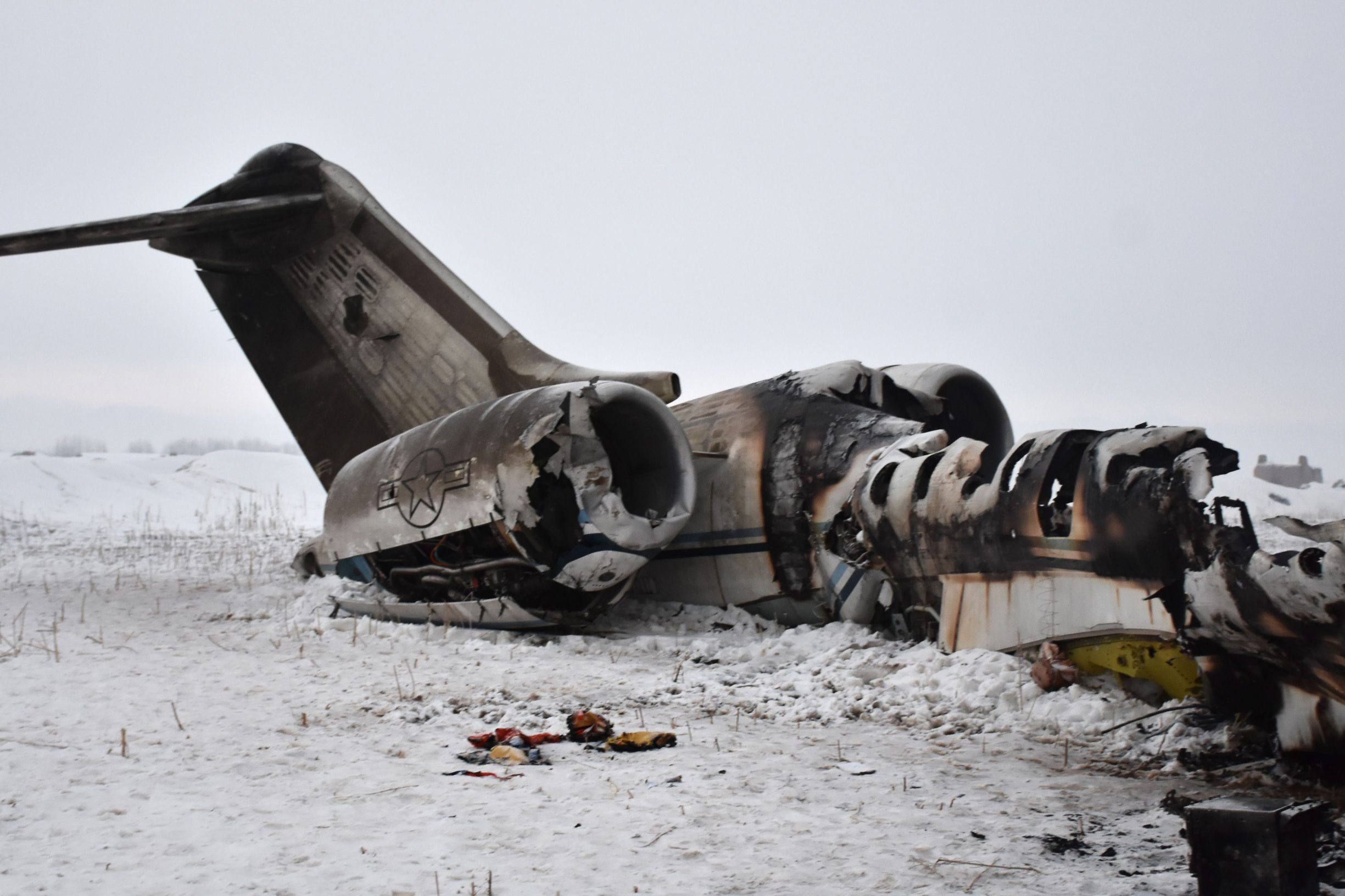 TOPSHOT - In this photograph taken on January 27, 2020 the wreckage of a US Bombardier E-11A jet is seen after it crashed in mountainous territory of Deh Yak district in Ghazni Province. - A US military jet crashed in mountainous territory in eastern Afghanistan, where there is a heavy Taliban presence, the Pentagon confirmed on January 27, rejecting the insurgents' suggestions that it was shot down. (Photo by STR / AFP)
