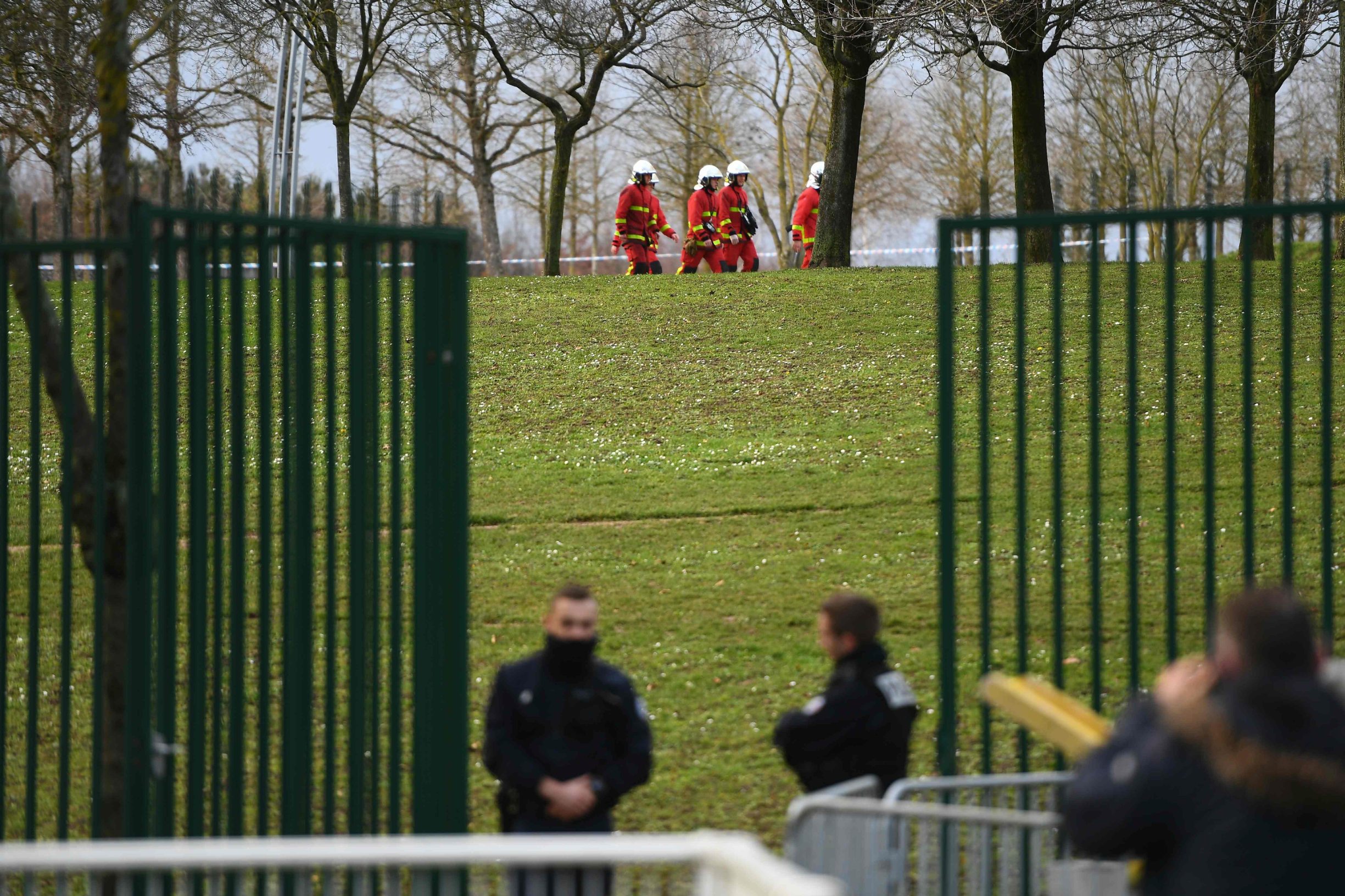 Police and firefighters gather in a park in the south of Paris' suburban city of Villejuif on January 3, 2020 where police shot dead a knife-wielding man who killed one person and injured at least two others. - The man had attacked 
