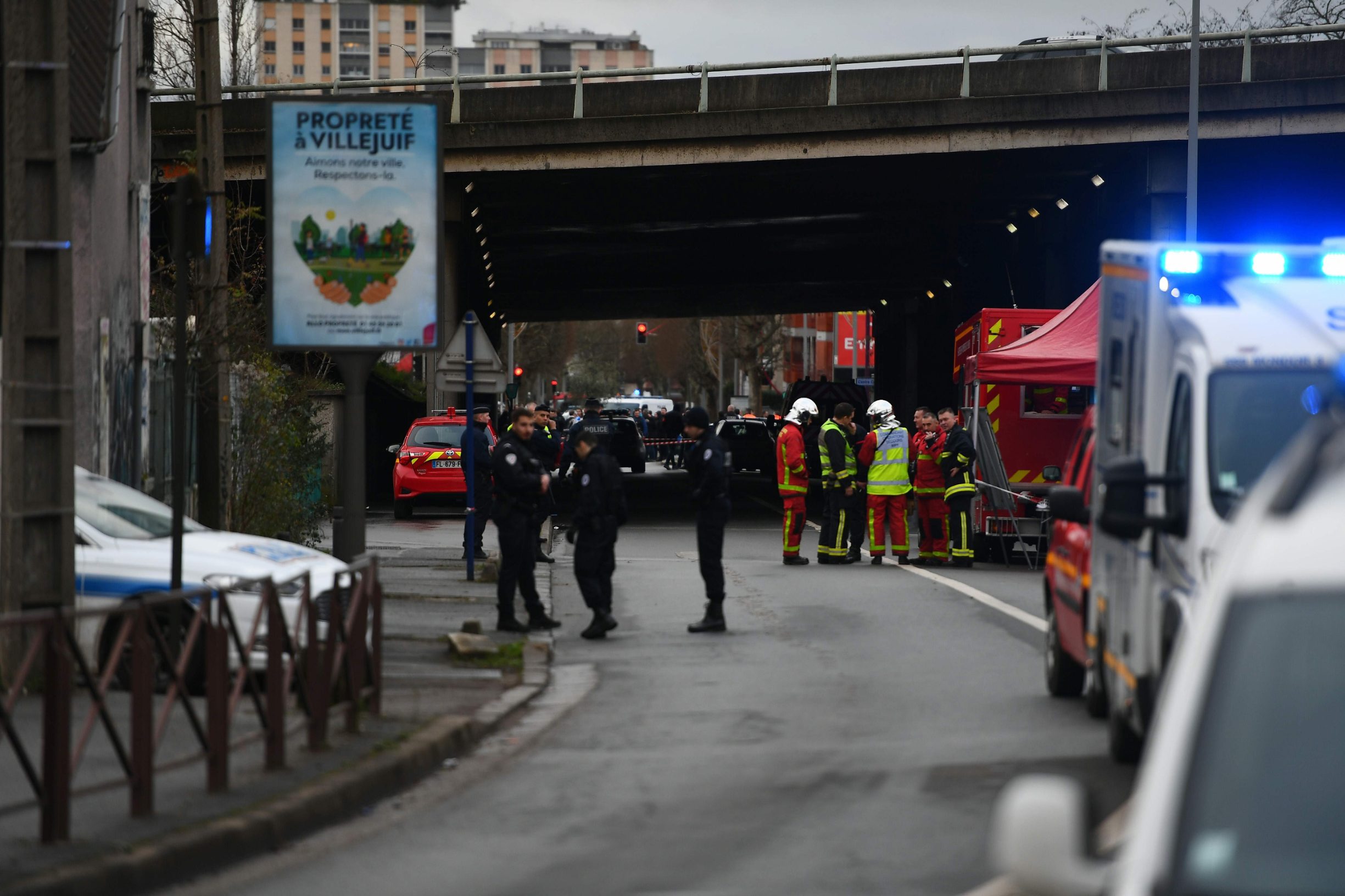 Police and firefighters gather on January 3, 2020 in L'Hay-les-Roses where police shot dead a knife-wielding man who killed one person and injured at least two others in a nearby park of the south of Paris' suburban city of Villejuif. - The man had attacked 