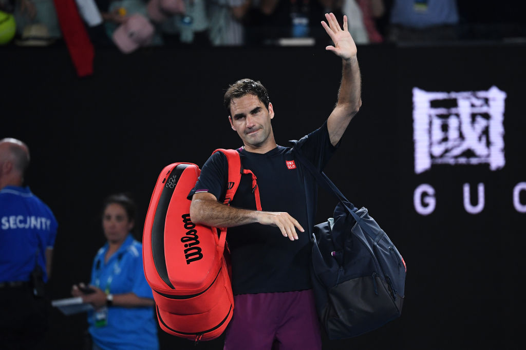 MELBOURNE, AUSTRALIA - JANUARY 30: Roger Federer of Switzerland walks off court after losing his Men's Singles Semifinal match against Novak Djokovic of Serbia on day eleven of the 2020 Australian Open at Melbourne Park on January 30, 2020 in Melbourne, Australia. (Photo by Hannah Peters/Getty Images)