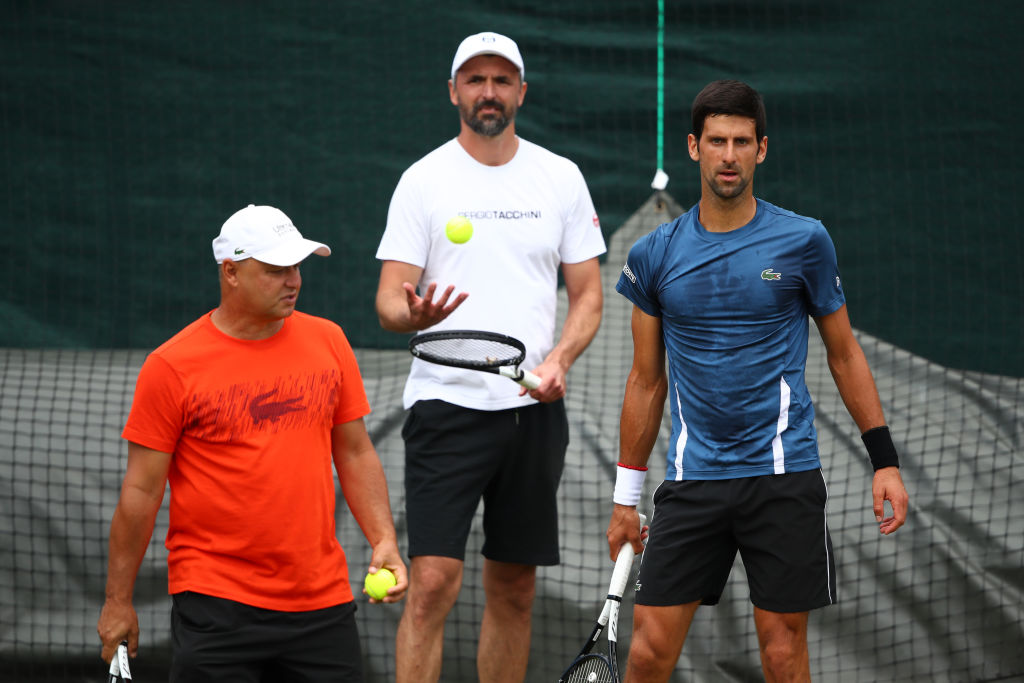 LONDON, ENGLAND - JUNE 30: (L-R) Marian Vajda, Goran Ivanisevic and Novak Djokovic of Serbia look on during a practice session ahead of The Championships - Wimbledon 2019 at All England Lawn Tennis and Croquet Club on June 30, 2019 in London, England. (Photo by Clive Brunskill/Getty Images)