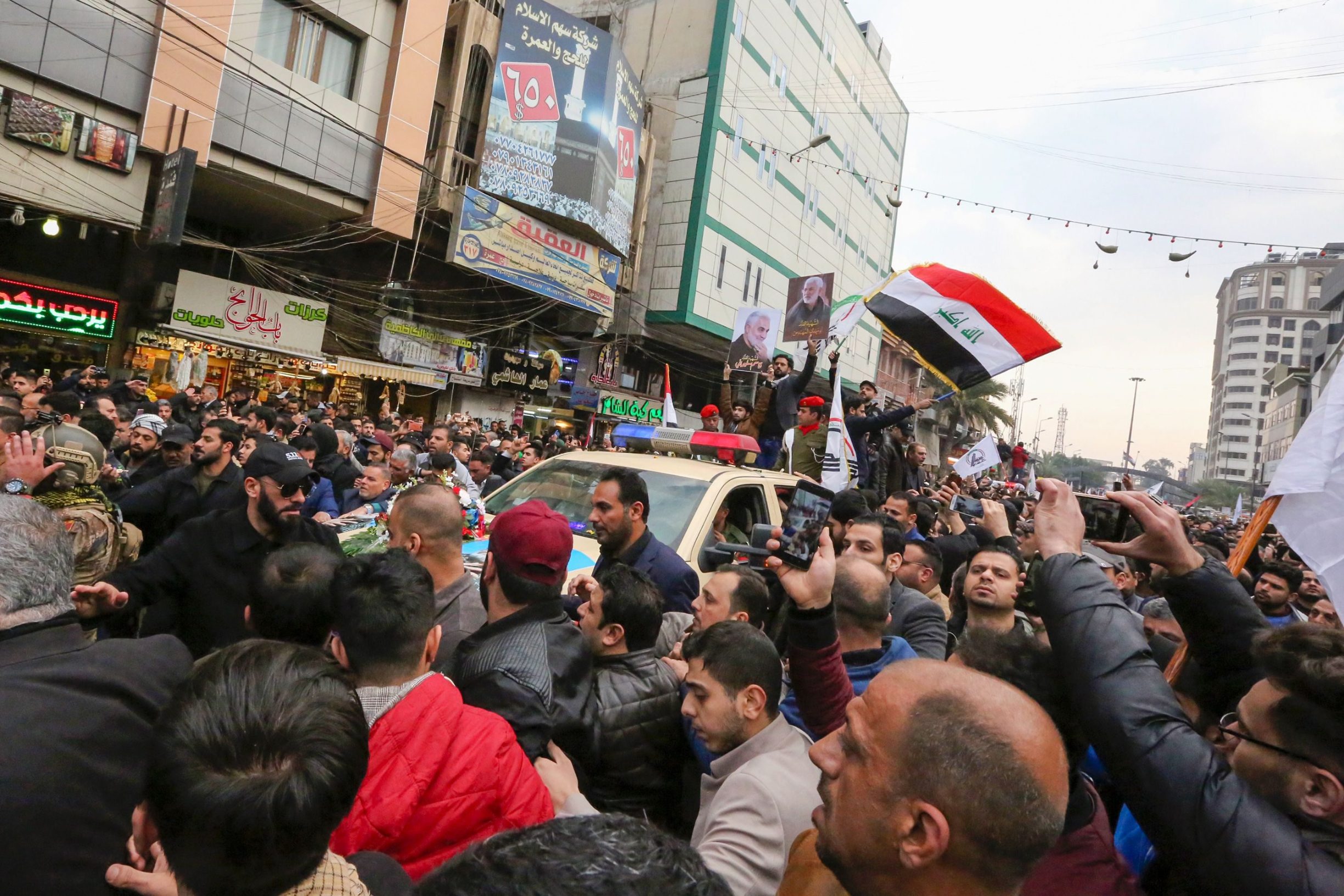 Mourners attend a funeral procession for Iraqi paramilitary chief Abu Mahdi al-Muhandis and Iranian military commander Qasem Soleimani, in Kadhimiya, a Shiite pilgrimage district of Baghdad, on January 4, 2020. - Thousands of Iraqis chanting 