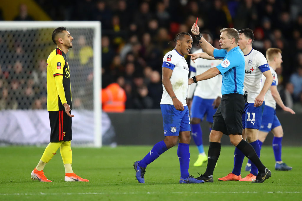 WATFORD, ENGLAND - JANUARY 04: Match Referee Graham Scott shows a red card to Roberto Pereyra of Watford during the FA Cup Third Round match between Watford FC and Tranmere Rovers at Vicarage Road on January 04, 2020 in Watford, England. (Photo by Julian Finney/Getty Images)