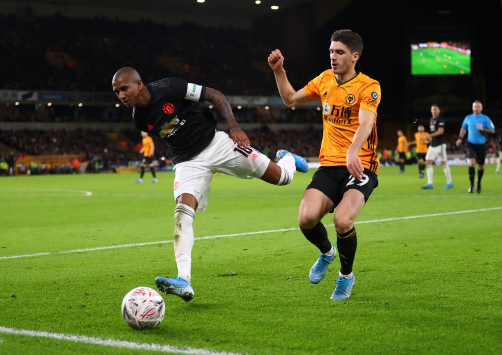 WOLVERHAMPTON, ENGLAND - JANUARY 04: Ruben Vinagre of Wolverhampton Wanderers battles for possession with Ashley Young of Manchester United  during the FA Cup Third Round match between Wolverhampton Wanderers and Manchester United at Molineux on January 04, 2020 in Wolverhampton, England. (Photo by Catherine Ivill/Getty Images)