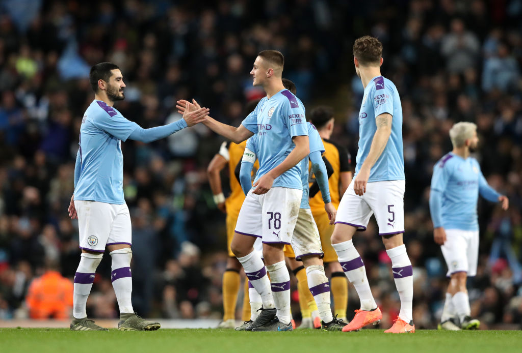 MANCHESTER, ENGLAND - JANUARY 04: Taylor Harwood-Bellis of Manchester City celebrates with teammate Ilkay Gundogan after scoring his team's third goal during the FA Cup Third Round match between Manchester City and Port Vale at Etihad Stadium on January 04, 2020 in Manchester, England. (Photo by Alex Livesey/Getty Images)