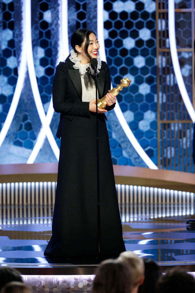 BEVERLY HILLS, CALIFORNIA - JANUARY 05: In this handout photo provided by NBCUniversal Media, LLC,  Awkwafina accepts the award for BEST PERFORMANCE BY AN ACTRESS IN A MOTION PICTURE - MUSICAL OR COMEDY for 