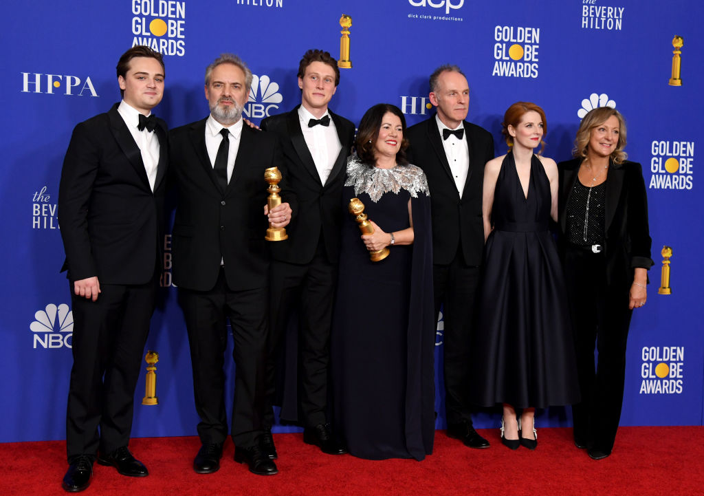 BEVERLY HILLS, CALIFORNIA - JANUARY 05: (L-R) Dean-Charles Chapman, Sam Mendes, George MacKay, Pippa Harris, Callum McDougall, Krysty Wilson-Cairns, and Jayne-Ann Tenggre of the film '1917,' winner of the Best Motion Picture - Drama award, pose in the press room during the 77th Annual Golden Globe Awards at The Beverly Hilton Hotel on January 05, 2020 in Beverly Hills, California. (Photo by Kevin Winter/Getty Images)