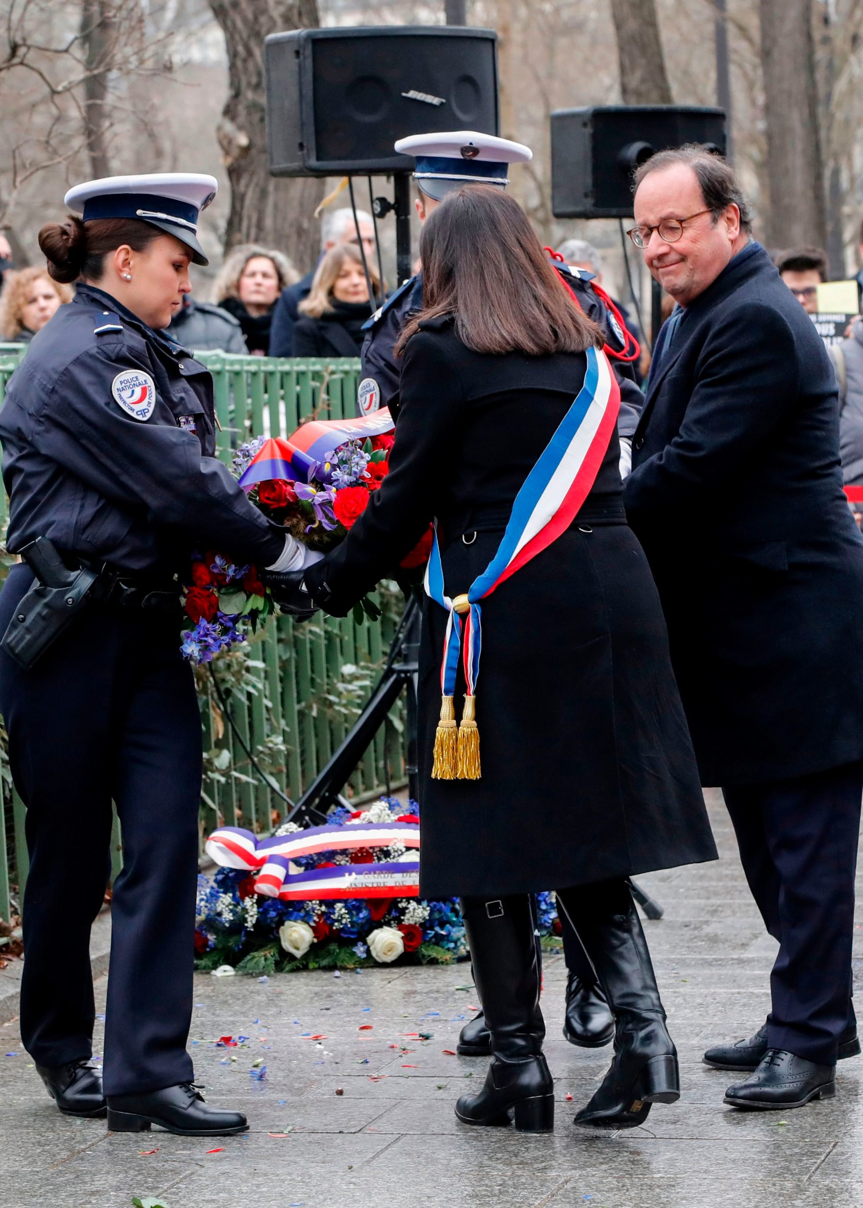 Former French President Francois Hollande and Mayor of Paris Anne Hidalgo lay a wreath on January 7, 2020 in Paris, in tribute to French police officer Ahmed Merabet who was killed by jihadist terrorists the same day of the attack of the satirical magazine Charlie Hebdo that killed 12 people, five years ago. - The attack on the satirical magazine Charlie Hebdo -- with its long history of mocking Islam and other religions -- was the first in a series of assaults that have claimed more than 250 lives since January 7, 2015, mostly at the hands of young French-born jihadists. (Photo by FRANCOIS GUILLOT / AFP)