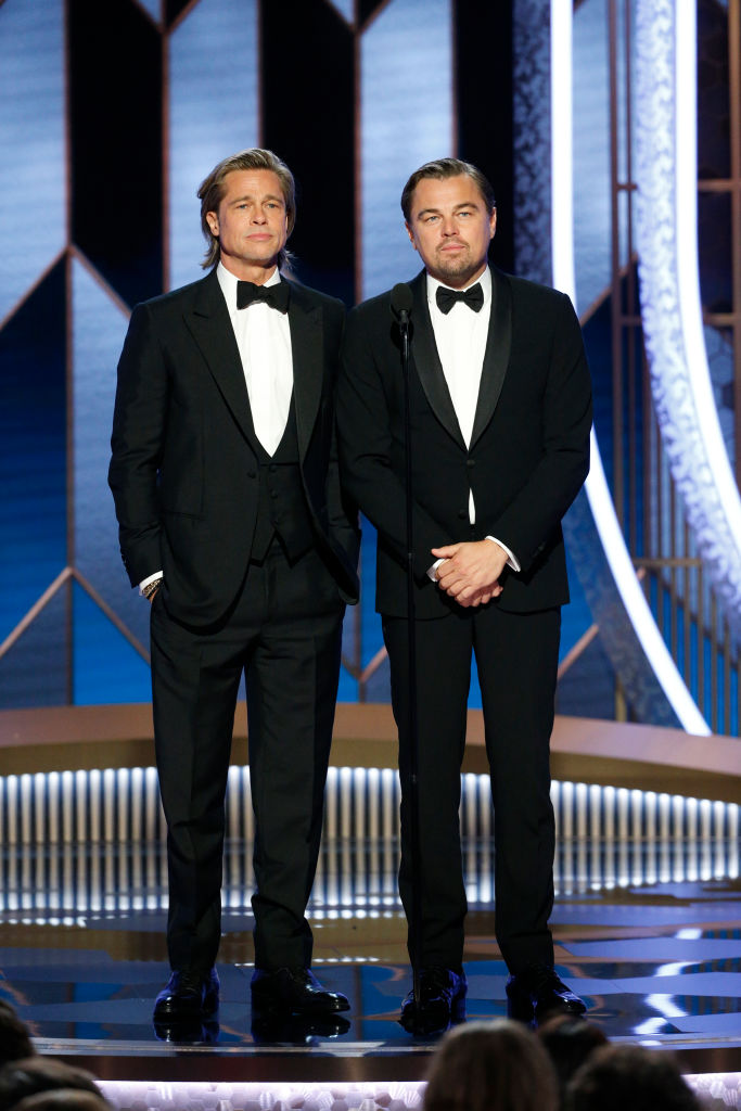 BEVERLY HILLS, CALIFORNIA - JANUARY 05: In this handout photo provided by NBCUniversal Media, LLC, Brad Pitt and Leonardo DiCaprio speak onstage during the 77th Annual Golden Globe Awards at The Beverly Hilton Hotel on January 5, 2020 in Beverly Hills, California. (Photo by Paul Drinkwater/NBCUniversal Media, LLC via Getty Images)