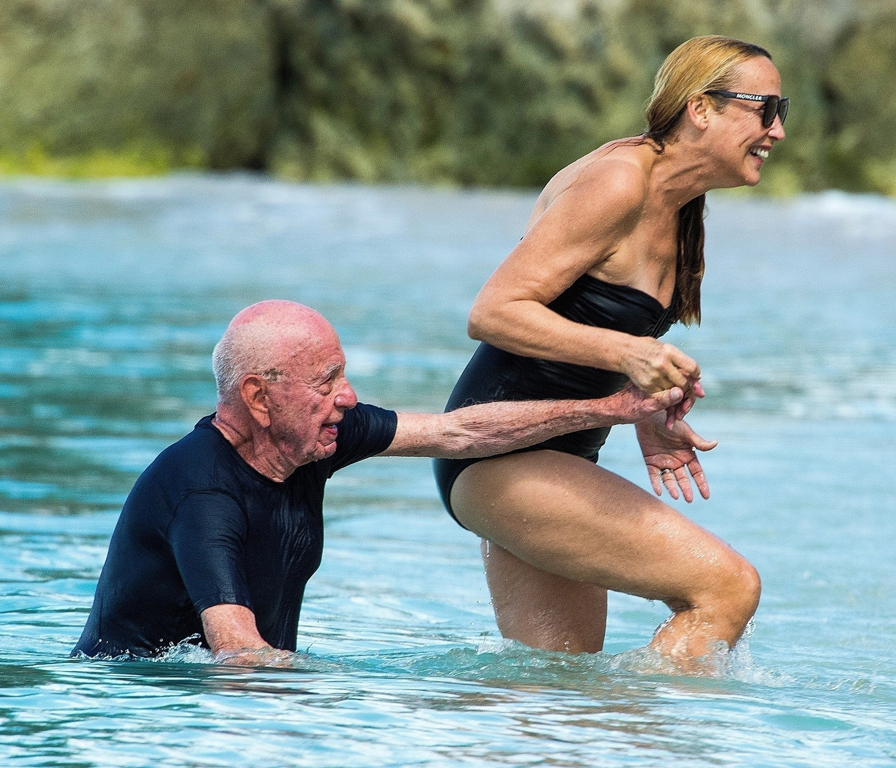 BRIDGETOWN, BARBADOS  - *PREMIUM-EXCLUSIVE*  - MUST CALL FOR PRICING BEFORE USAGE  - 

She was once the most photographed models of her hay day, Jerry Hall now 63-year old still looks incredible in her black swimsuit as she frolics in the sea with husband Rupert Murdoch, 88, out on holiday in Barbados.

With both enjoying a little affection by giving each other a little kiss, The American media mogul Murdoch struggled to stay on his feet trying to fight the currents of the sea and needed a helping hand from wife Jerry with both in a joyful mood as Jerry herself took a tumble during the process. 

The couple eventually made their way out of the sea and back onto the beach where they then sat and relaxed with their reading material after Rupert applied some more sunscreen to protect him from the scorching Caribbean sun!

*UK Clients - Pictures Containing Children
Please Pixelate Face Prior To Publication*, Image: 491303704, License: Rights-managed, Restrictions: RIGHTS: WORLDWIDE EXCEPT IN ITALY, Model Release: no, Credit line: BACKGRID / Backgrid UK / Profimedia