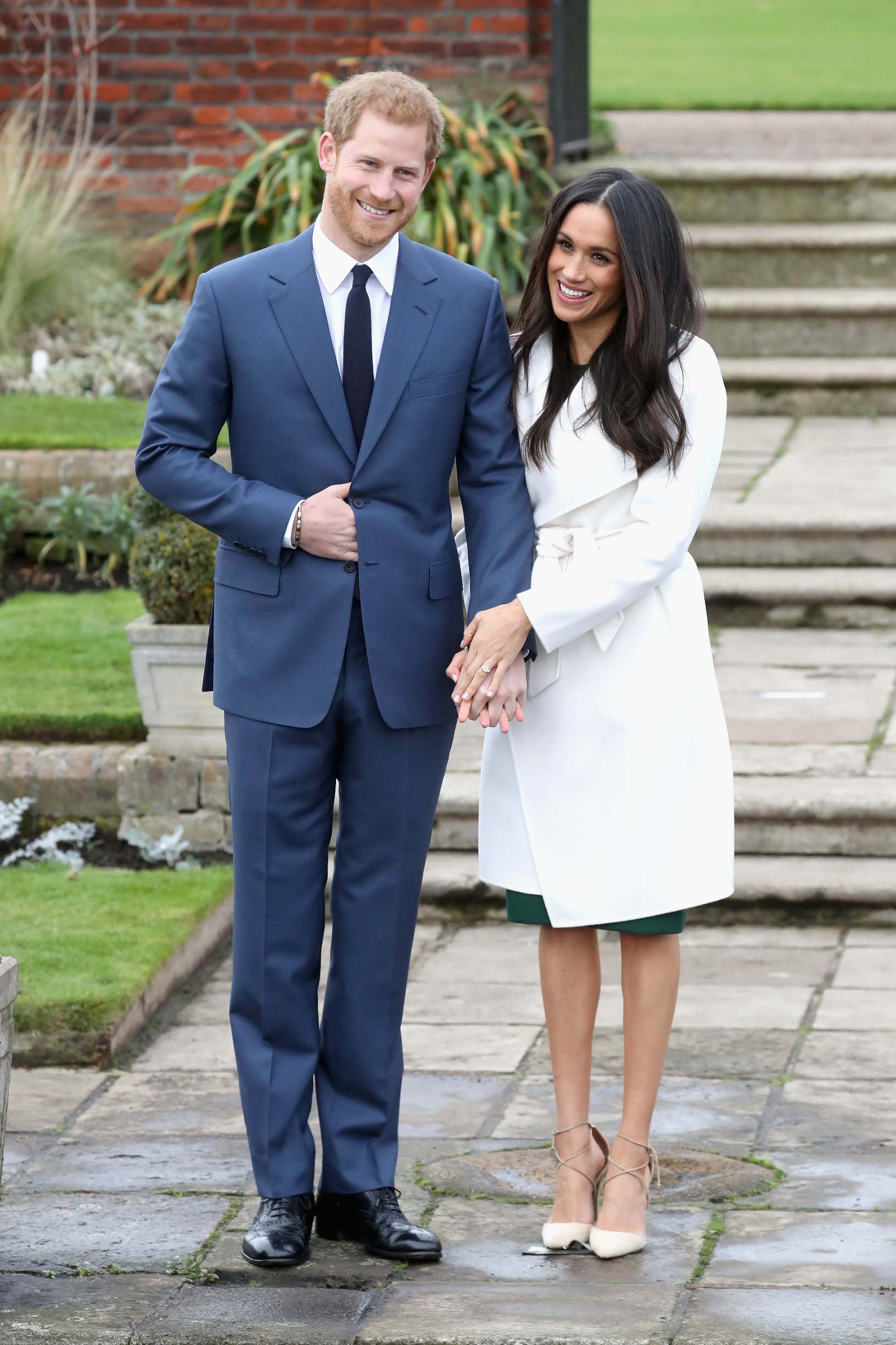 LONDON, ENGLAND - NOVEMBER 27:  Prince Harry and Meghan Markle during an official photocall to announce the engagement of Prince Harry and actress Meghan Markle at The Sunken Gardens at Kensington Palace on November 27, 2017 in London, England.  Prince Harry and Meghan Markle have been a couple officially since November 2016 and are due to marry in Spring 2018.  (Photo by Chris Jackson/Getty Images)