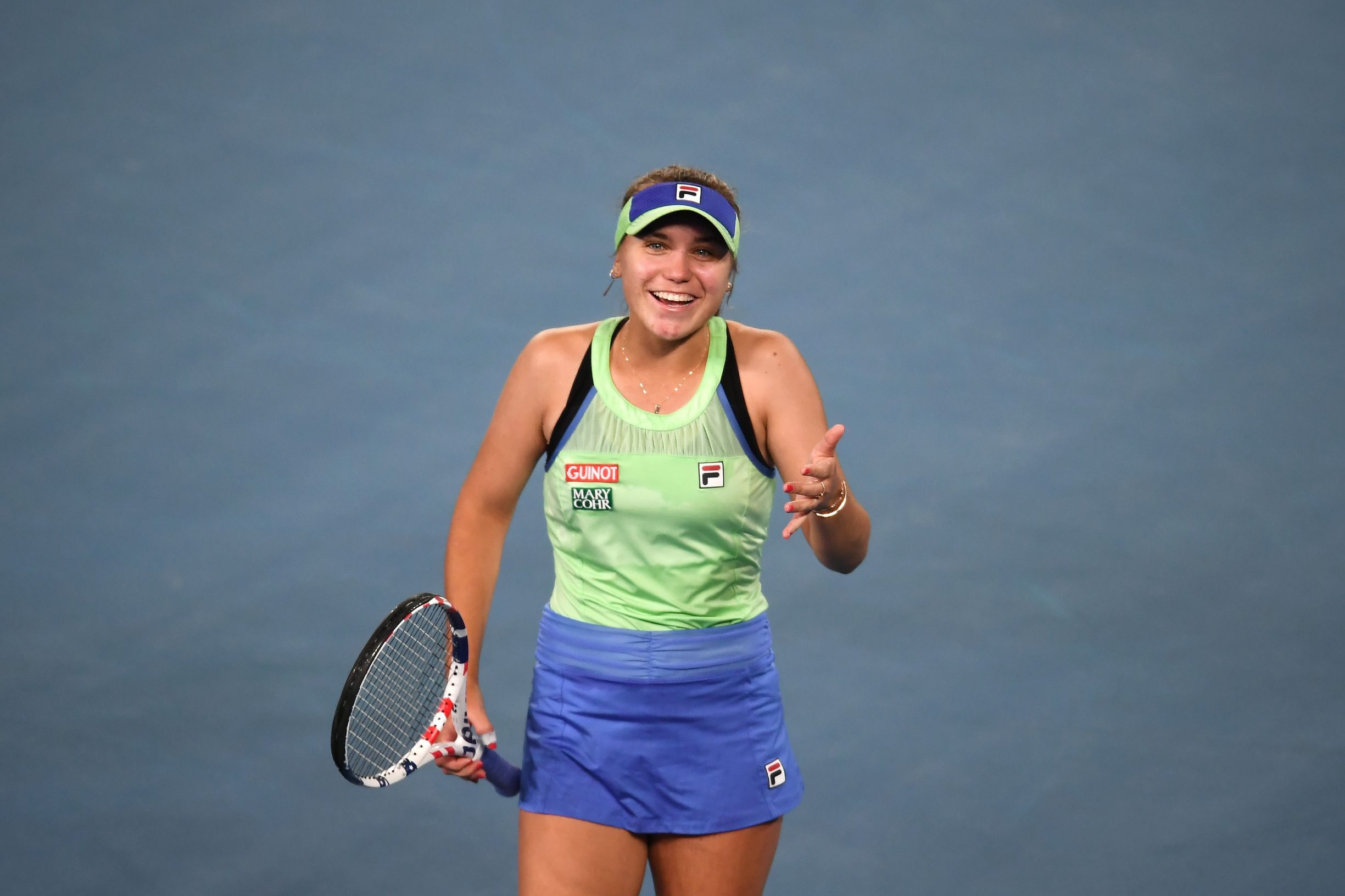 Sofia Kenin of the US celebrates after victory against Spain's Garbine Muguruza during their women's singles final match on day thirteen of the Australian Open tennis tournament in Melbourne on February 1, 2020. (Photo by Manan VATSYAYANA / AFP) / IMAGE RESTRICTED TO EDITORIAL USE - STRICTLY NO COMMERCIAL USE