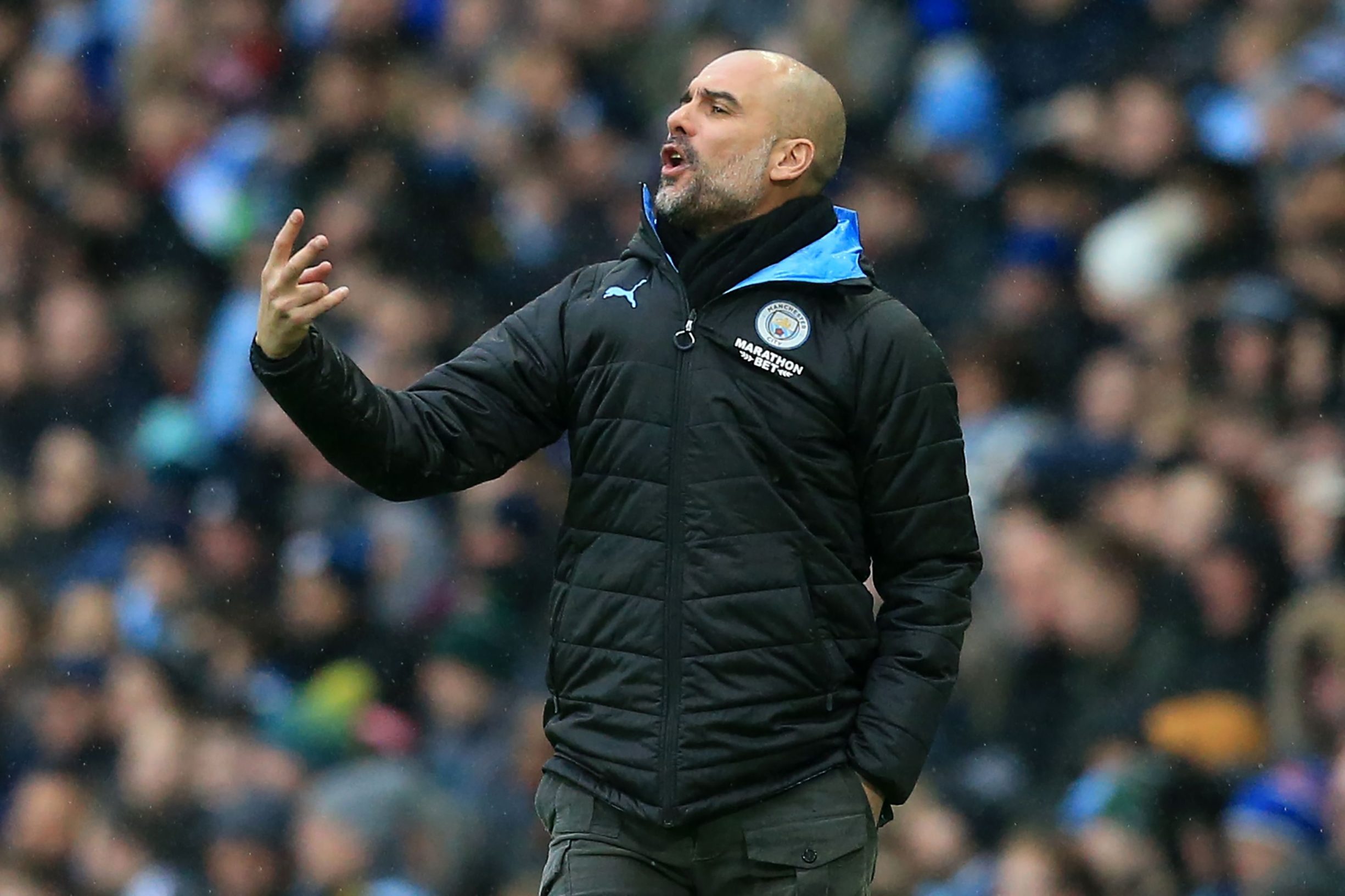 Manchester City's Spanish manager Pep Guardiola gestures on the touchline during the English FA Cup fourth round football match between Manchester City and Fulham at the Etihad Stadium in Manchester, north west England, on January 26, 2020. (Photo by Lindsey Parnaby / AFP) / RESTRICTED TO EDITORIAL USE. No use with unauthorized audio, video, data, fixture lists, club/league logos or 'live' services. Online in-match use limited to 120 images. An additional 40 images may be used in extra time. No video emulation. Social media in-match use limited to 120 images. An additional 40 images may be used in extra time. No use in betting publications, games or single club/league/player publications. / 