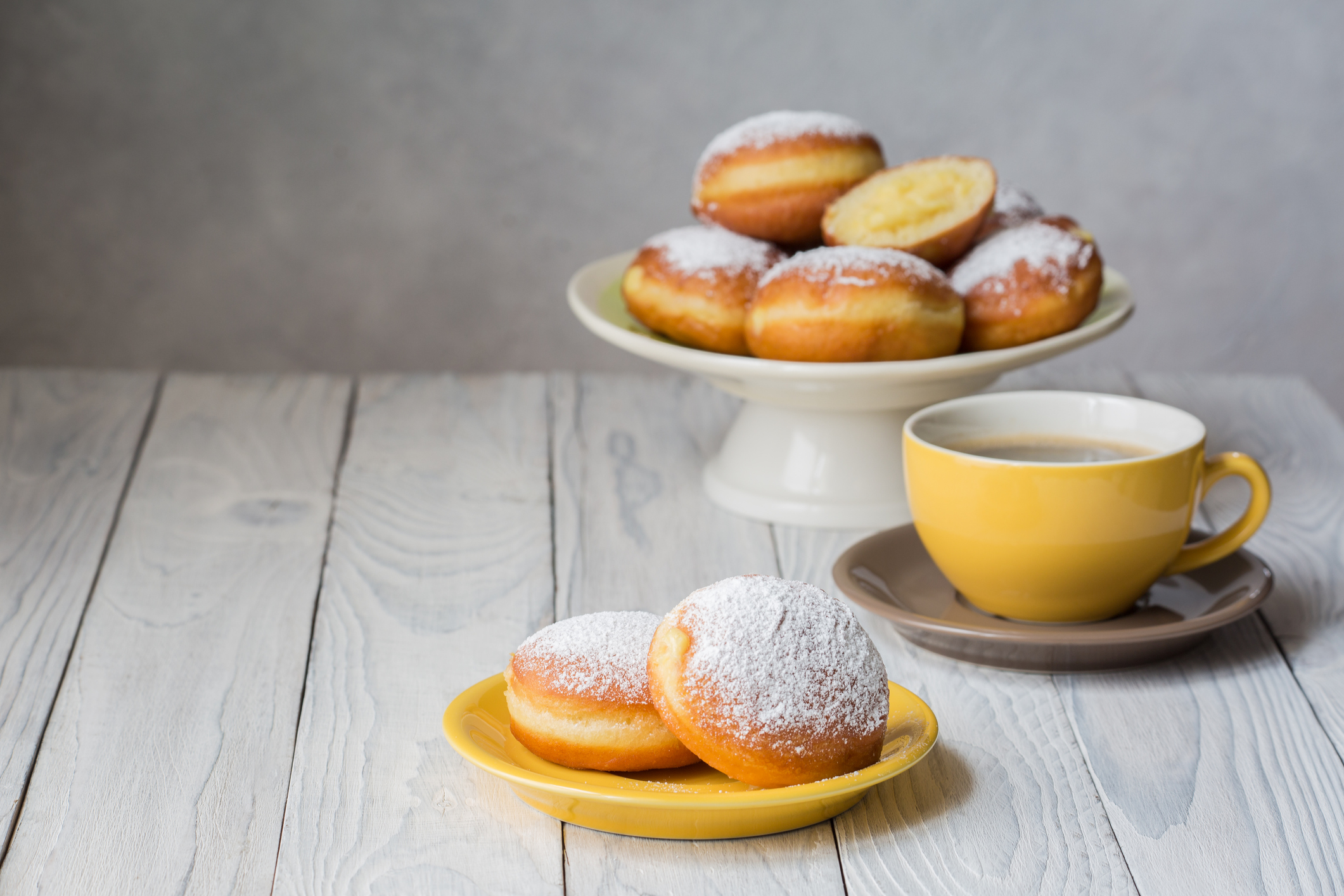 Bombolone - filled sweet yeast dough fried in oil, with a cream. Italian carnival  doughnuts.