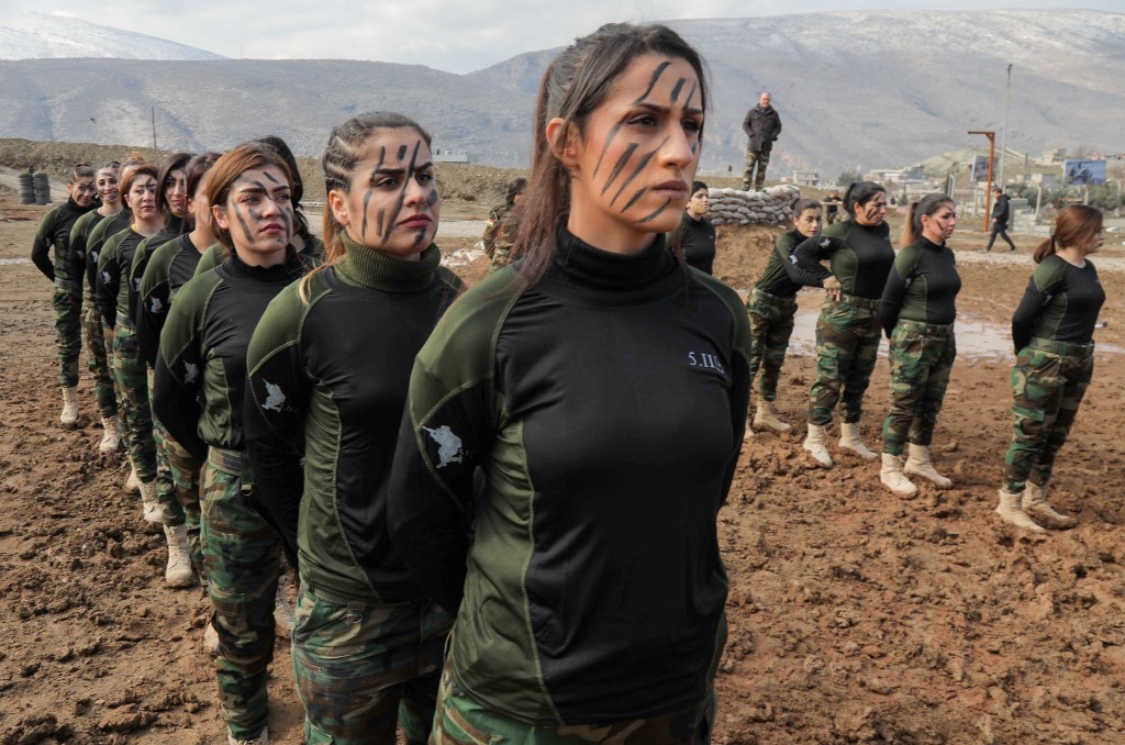Iraqi Kurdish Peshmerga female officers take part in a graduation ceremony in the Kurdish town of Soran, 100 kilometres northeast of Arbil, the capital of Iraq's autonomous Kurdish region, on February 12, 2020. (Photo by SAFIN HAMED / AFP)