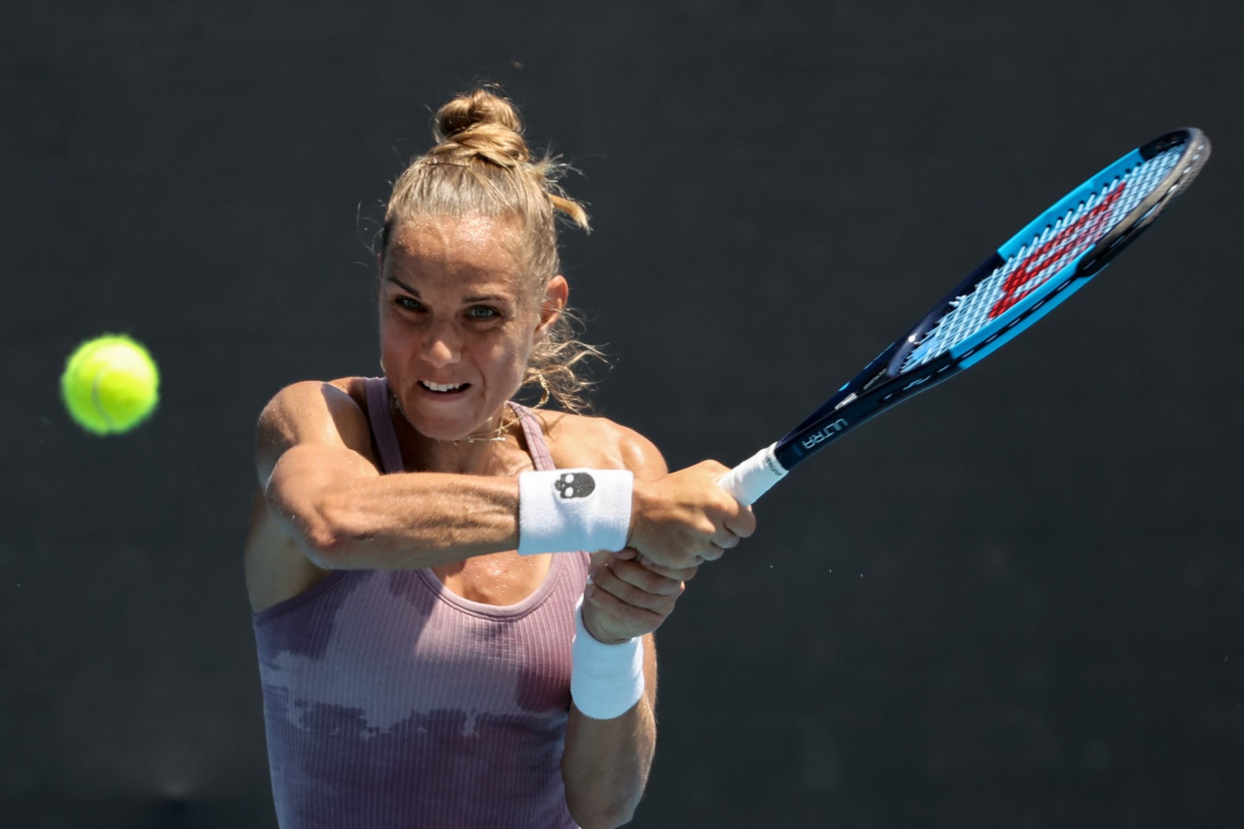 Netherlands' Arantxa Rus hits a return against Poland's Magda Linette during their women's singles match on day two of the Australian Open tennis tournament in Melbourne on January 21, 2020. (Photo by DAVID GRAY / AFP) / IMAGE RESTRICTED TO EDITORIAL USE - STRICTLY NO COMMERCIAL USE
