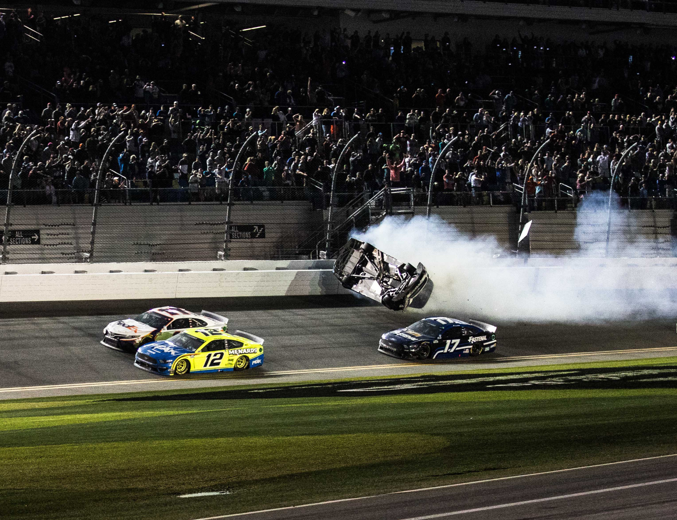 Ryan Newman's car flips as Denny Hamlin (110 and Ryan Blaney (12) battle to the finish line at the conclusion of the 62nd Daytona 500,  on Monday, February 17, 2020 in Daytona, Florida. Photo by /UPI, Image: 499189293, License: Rights-managed, Restrictions: , Model Release: no, Credit line: EDWIN LOCKE / UPI / Profimedia