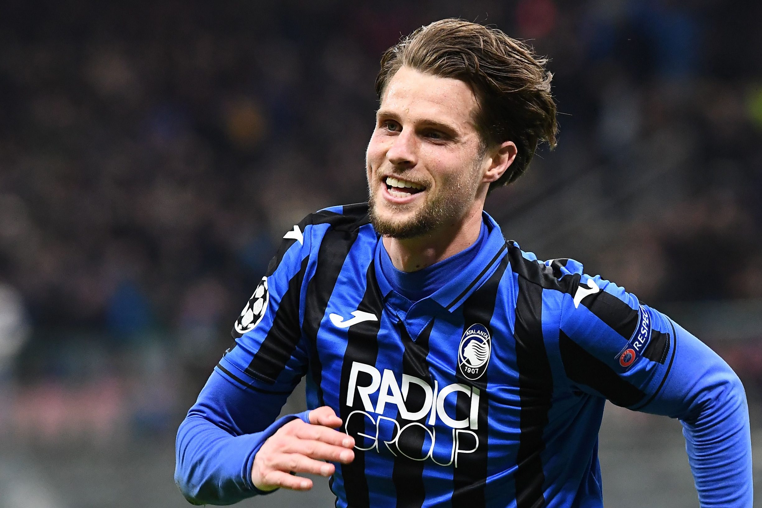 Atalanta's Dutch defender Hans Hateboer celebrates after scoring his second goal during the UEFA Champions League round of 16 first leg football match Atalanta Bergamo vs Valencia on February 19, 2020 at the San Siro stadium in Milan. (Photo by Vincenzo PINTO / AFP)
