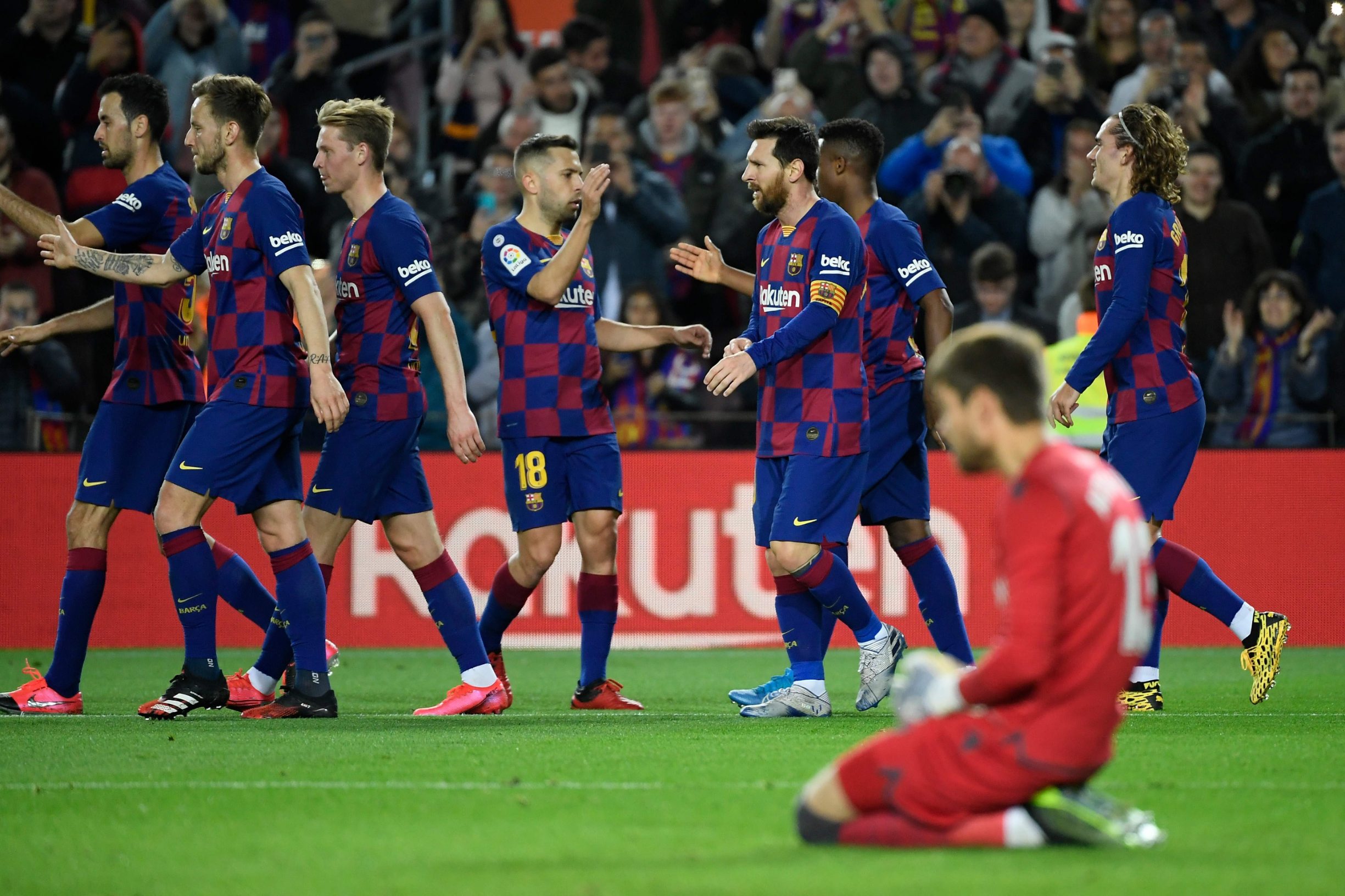 Barcelona's Guinea-Bissau forward Ansu Fati (2R) celebrates with teammates after scoring during the Spanish league football match be tween FC Barcelona and Levante UD at the Camp Nou stadium in Barcelona, on February 2, 2020. (Photo by LLUIS GENE / AFP)