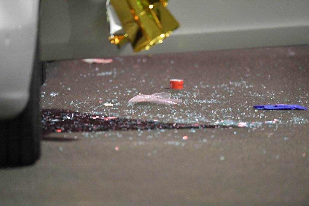 20 February 2020, Hessen, Hanau: Glass splinters lie next to a car covered with thermo foil. Several people have been killed by gunshots in Hanau, Hesse. Photo: Boris R�ssler/dpa